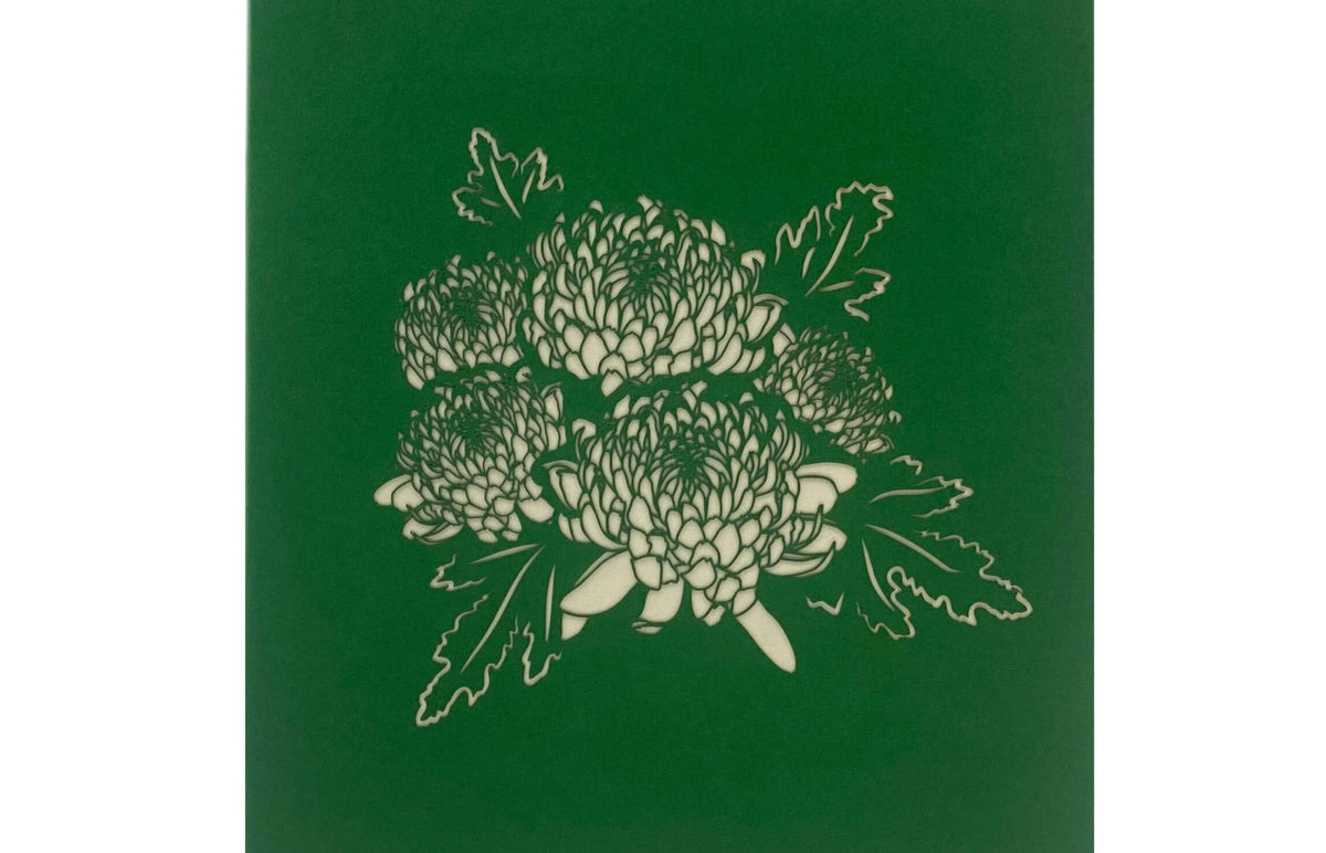 grüne karte mit einer chrysantheme bluete
