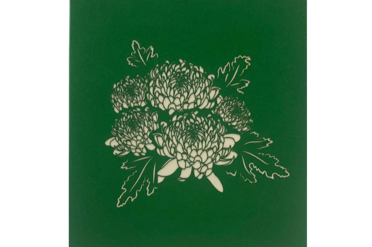 grüne karte mit einer chrysantheme bluete