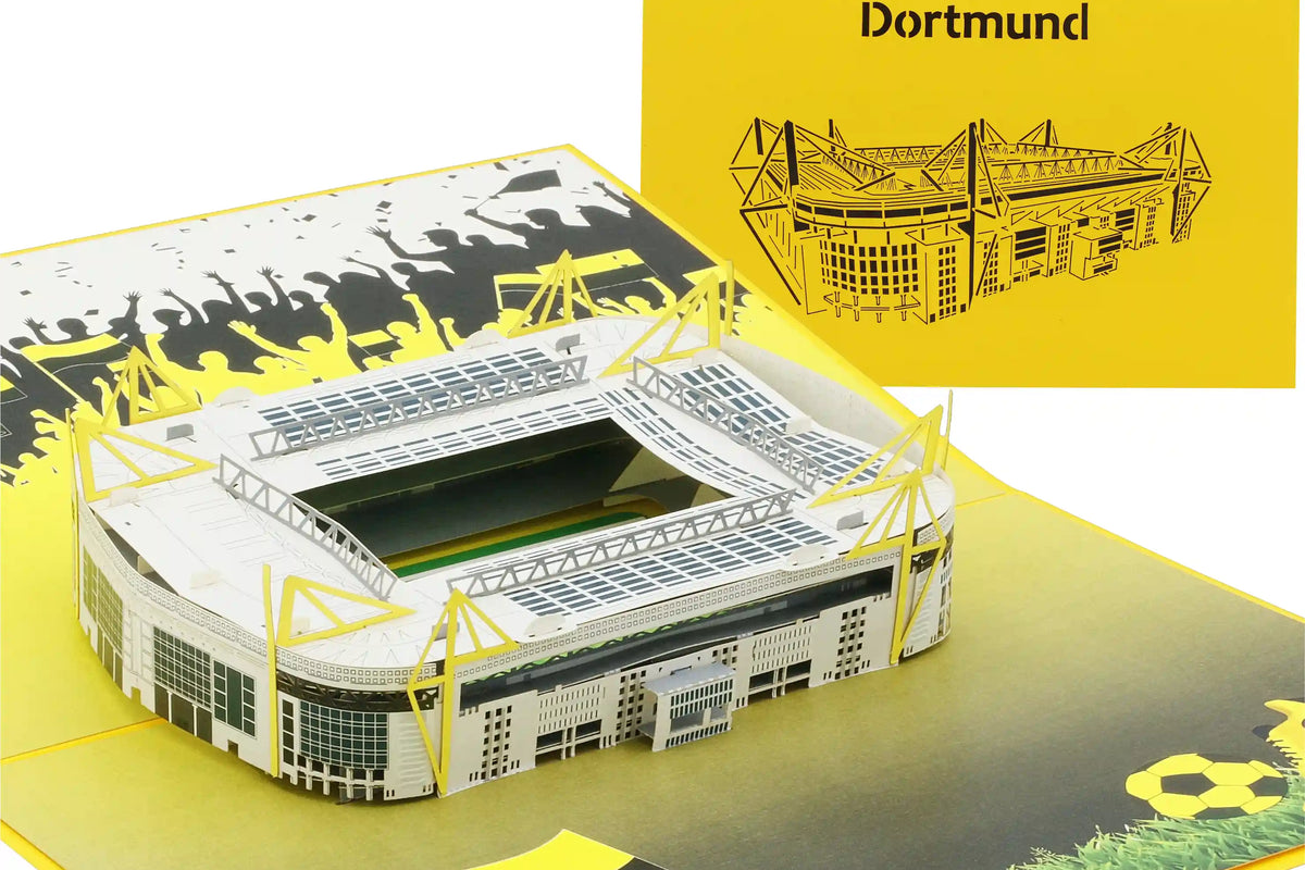 Aufgeklappte Pop-up-Karte mit einem detailreichen Modell eines Fußballstadions und einer gelben Karte mit einem schwarzem Scherenschnitt des Stadions und dem Schriftzug Dortmund.