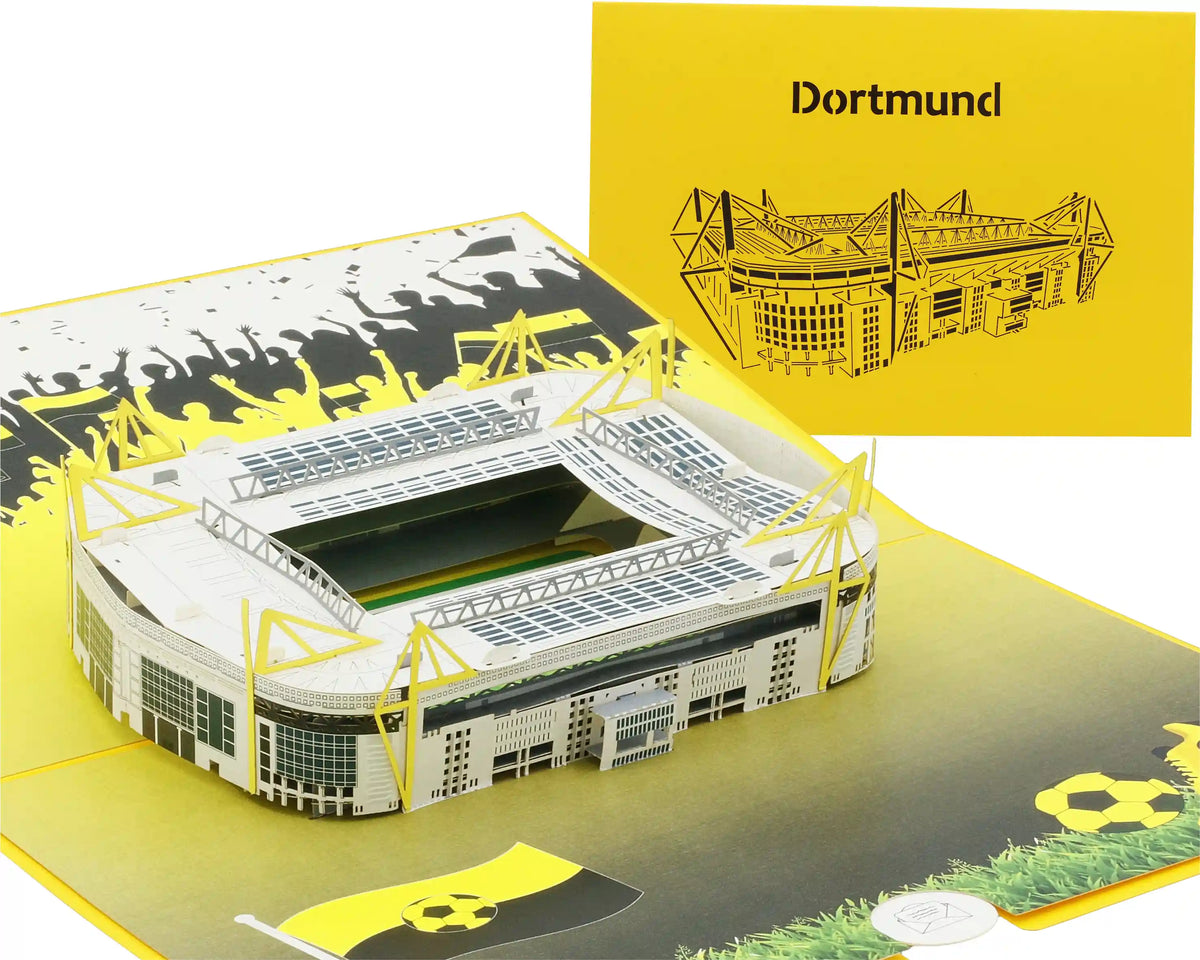Aufgeklappte Pop-up-Karte mit einem detailreichen Modell eines Fußballstadions und einer gelben Karte mit einem schwarzem Scherenschnitt des Stadions und dem Schriftzug Dortmund.