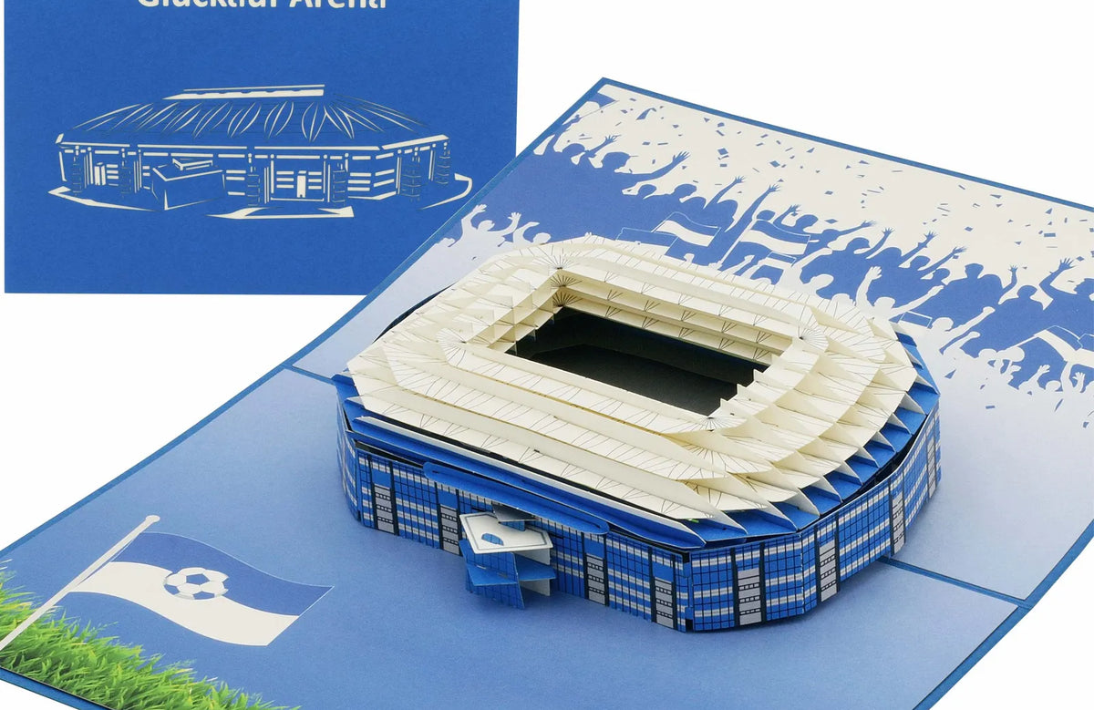 Pop-up Karte mit einem Stadionmodell und blauer Klappkarte mit dem Schriftzug Glück auf Arena, ideal für Fußballfans und als Geschenk aus Gelsenkirchen.