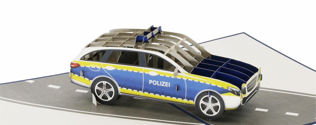 Klappkarte mit einem polizeiauto auf einer straße