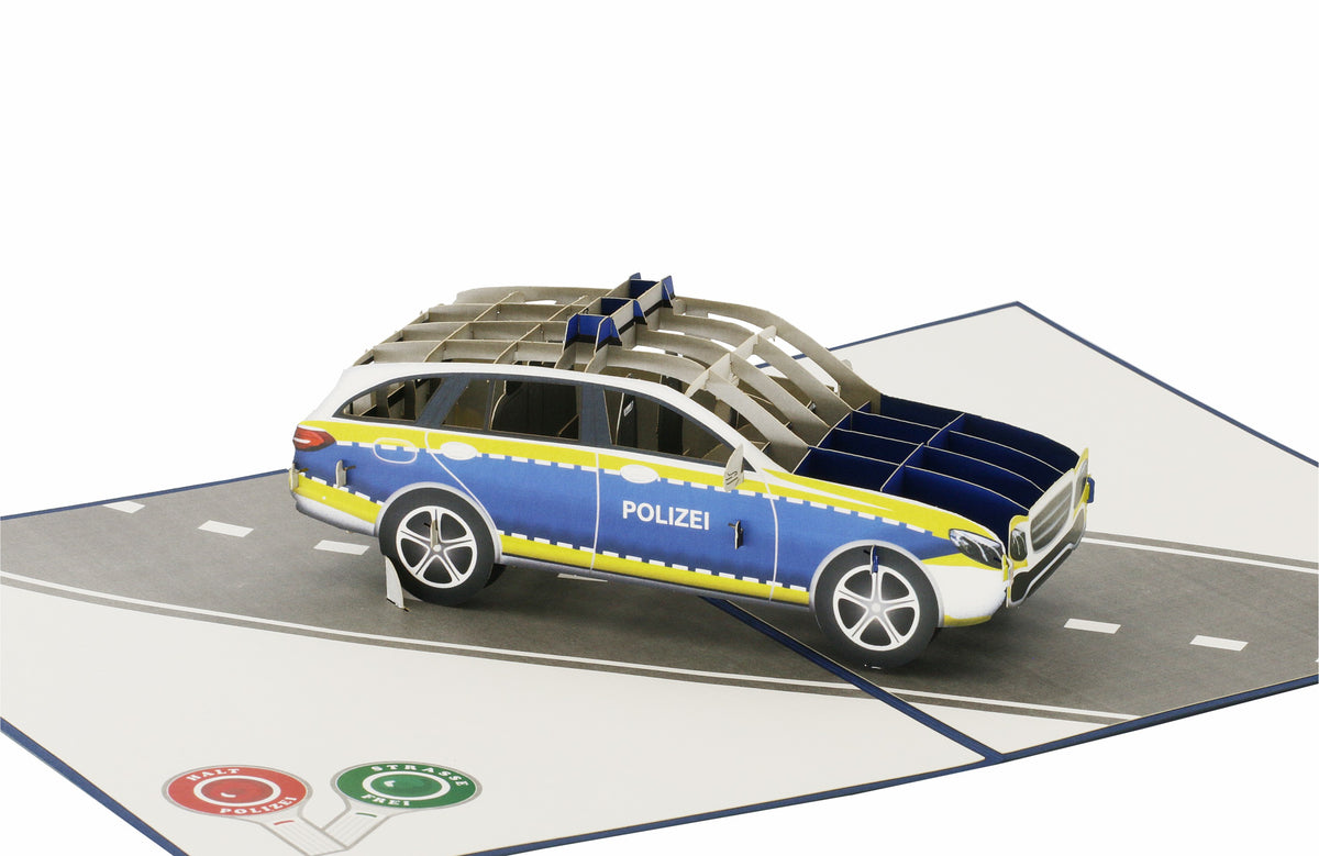 Klappkarte mit einem polizeiauto auf einer straße