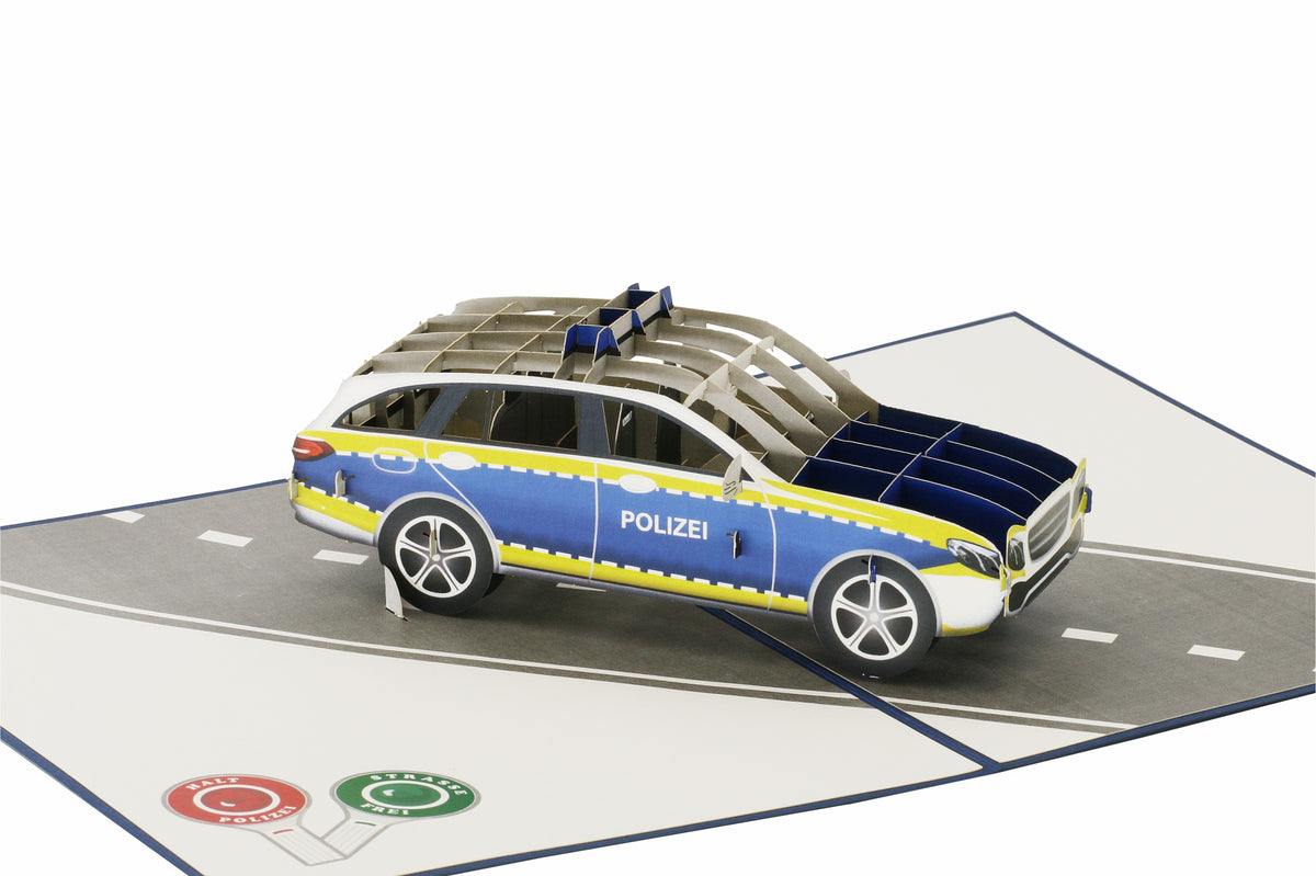 Klappkarte mit einem polizeiauto auf einer straße