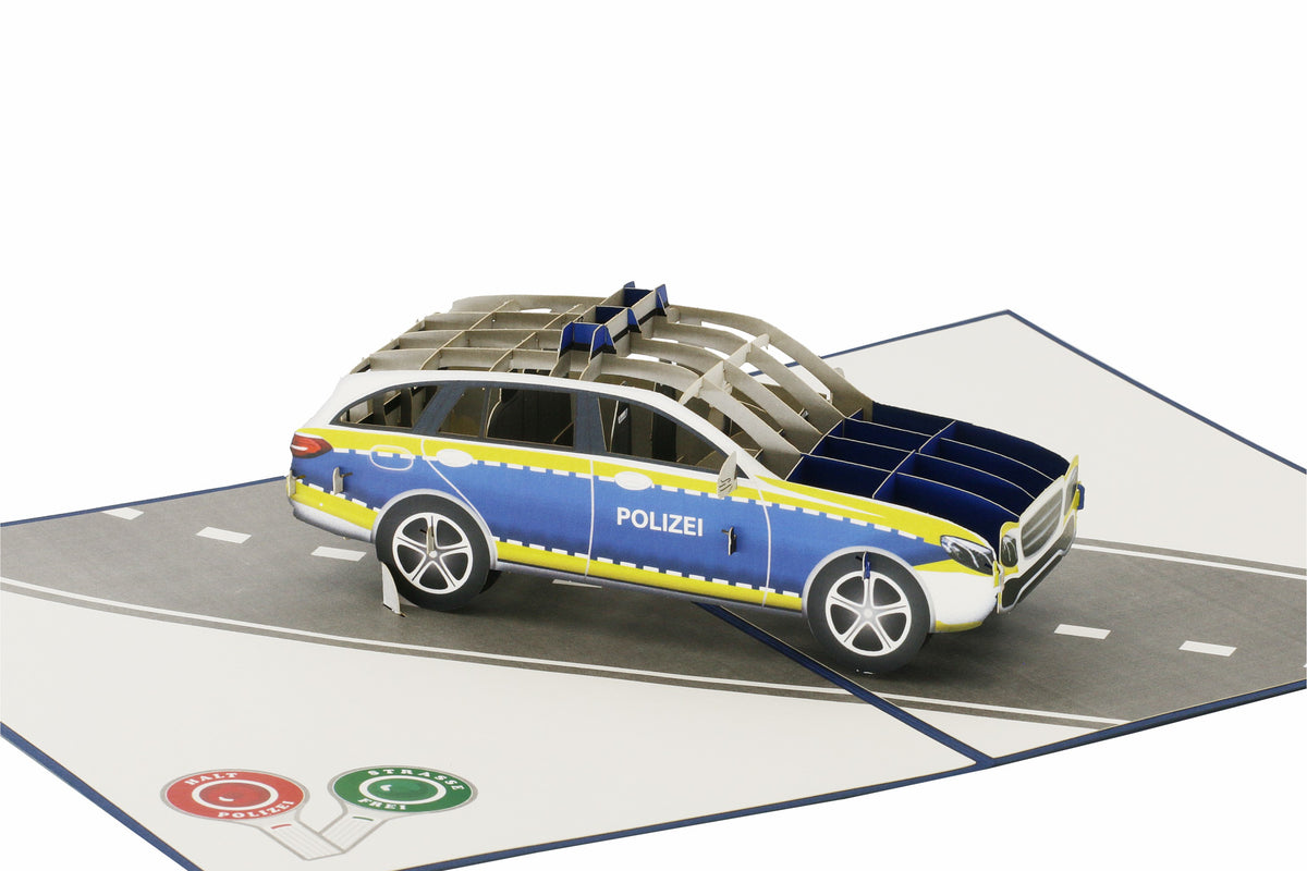 Klappkarte mit einem polizeiauto auf einer straße