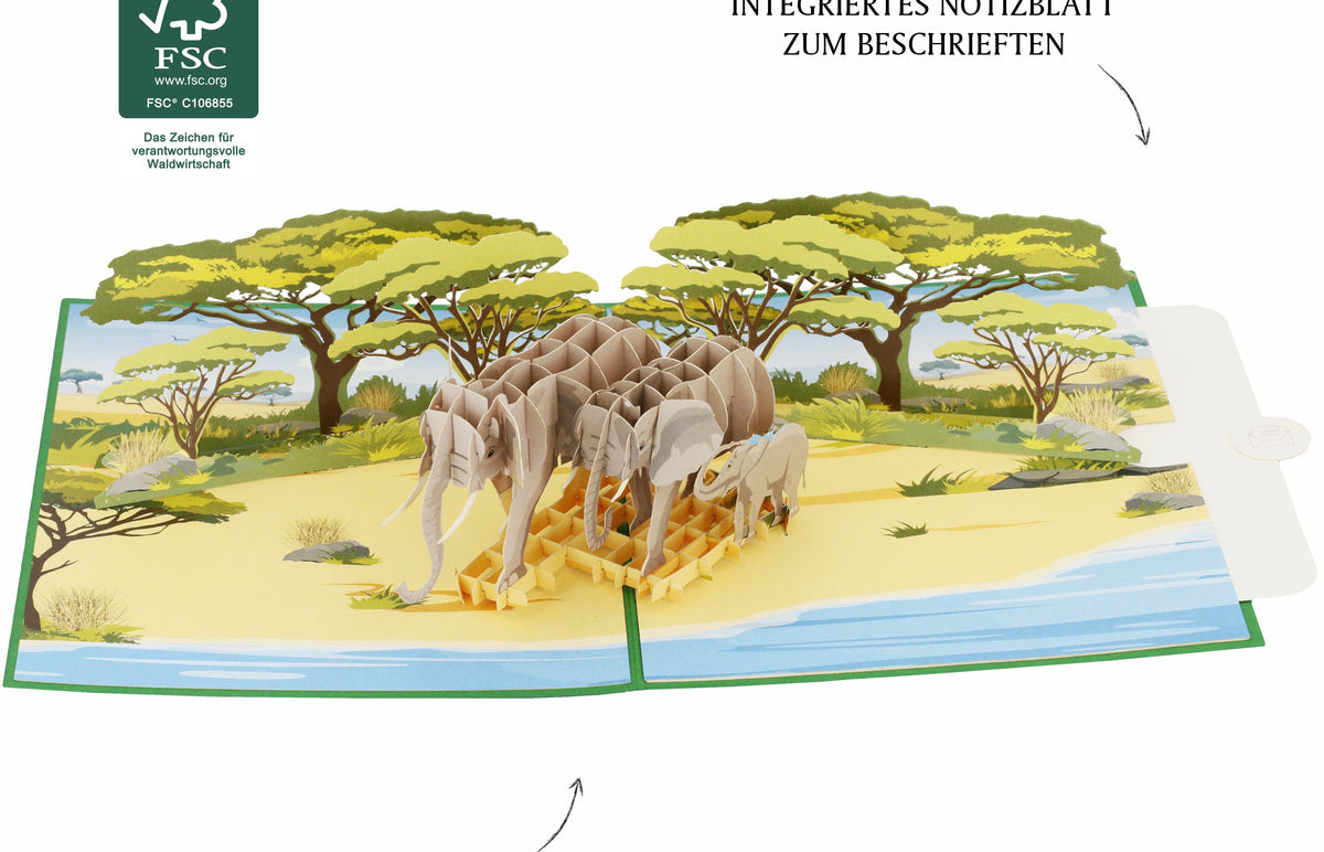 Aufgeklappte Pop-up-Karte mit Elefanten in der Savanne, dazu FSC-Logo und die Hinweise integriertes Notizblatt zum Beschriften sowie hochwertiges und stabiles Feinpapier.