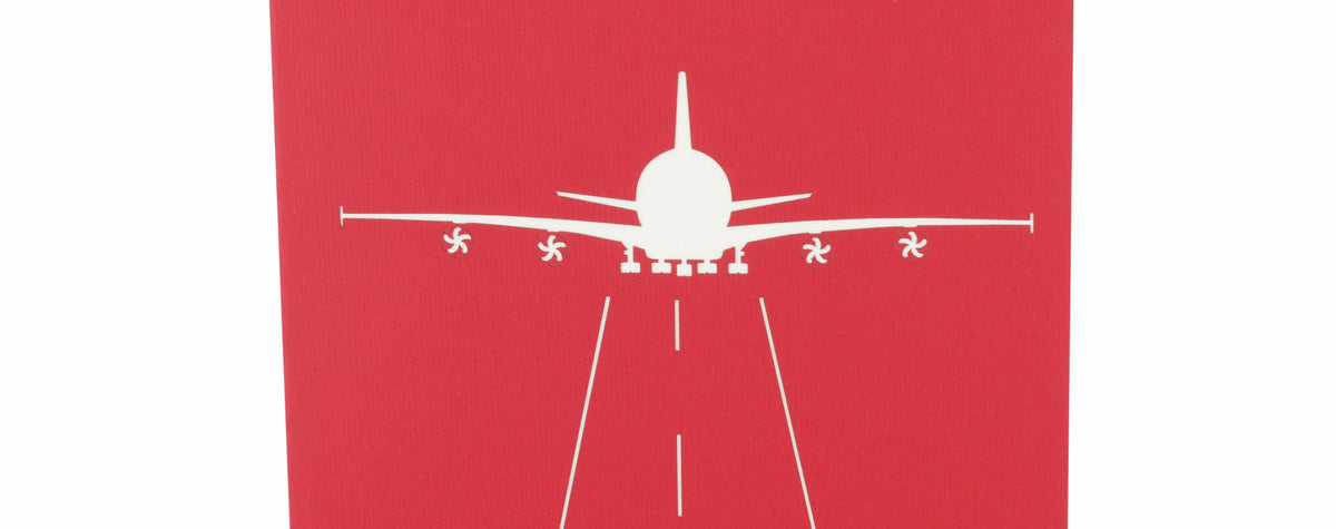 rote karte mit weißem flugzeug auf der Startbahn