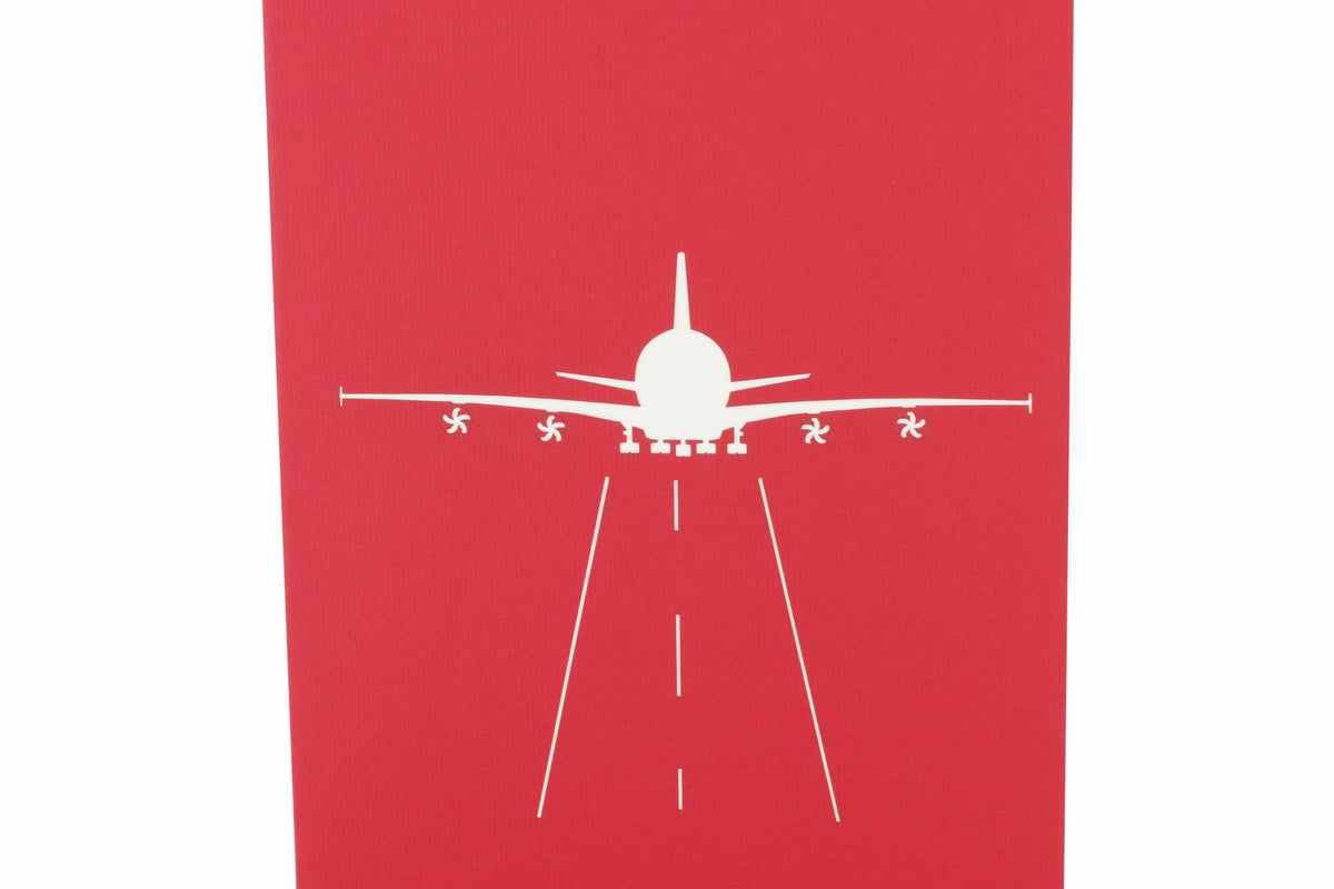 rote karte mit weißem flugzeug auf der Startbahn