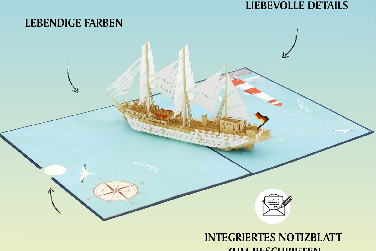 Geöffnete Pop-up-Karte mit einem aufklappbaren Gorch Fock Segelschiff in der Mitte, Kompassrose und Möwe auf der Kartenfläche.