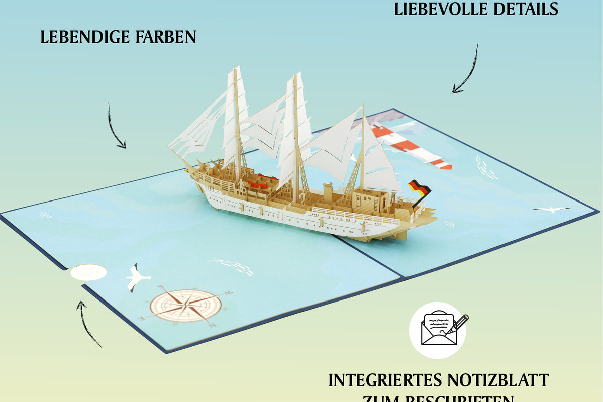 Geöffnete Pop-up-Karte mit einem aufklappbaren Gorch Fock Segelschiff in der Mitte, Kompassrose und Möwe auf der Kartenfläche.