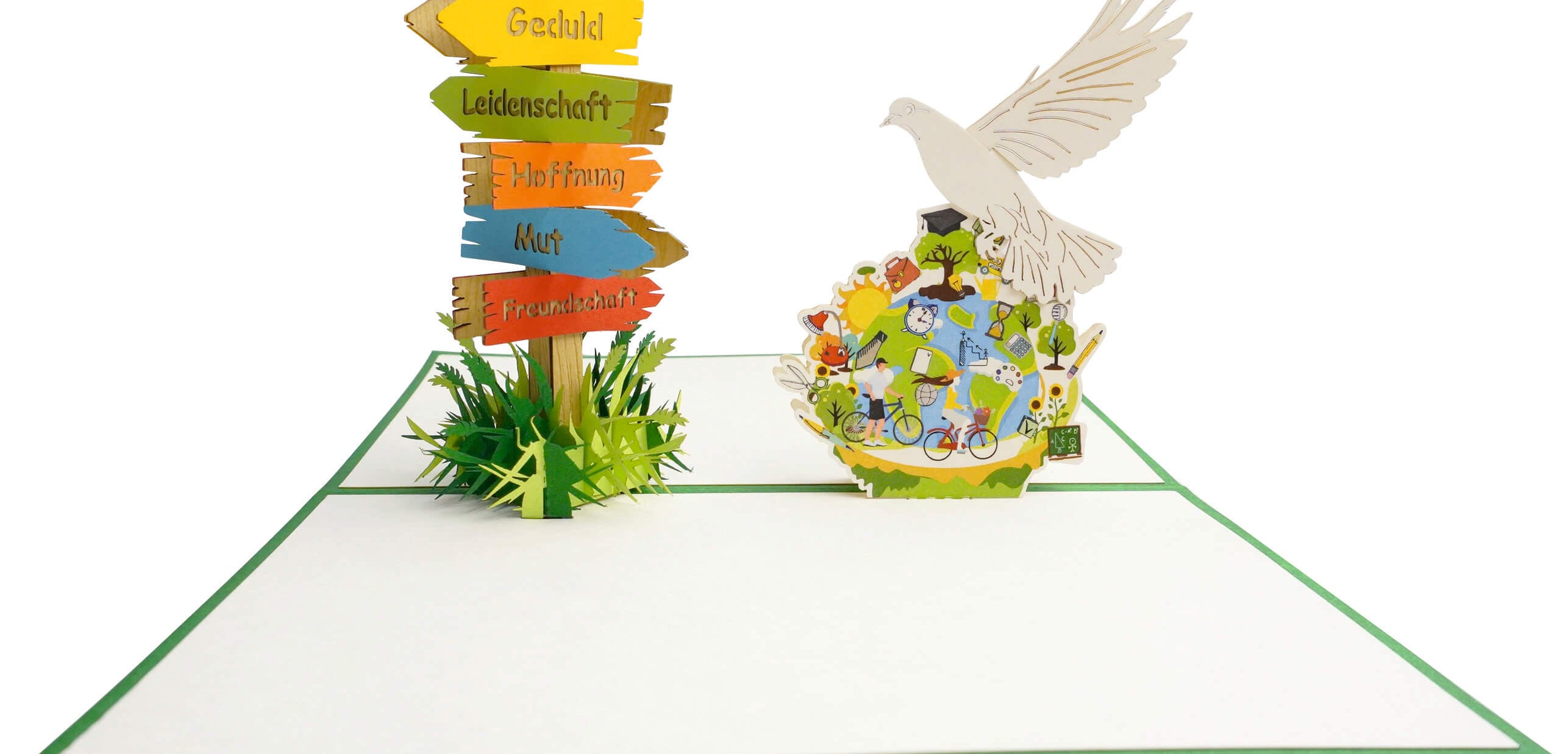 Aufgeklappte Pop-up-Karte mit Friedenstaube und bunter Weltkugel, daneben ein Wegweiser mit den Schildern Geduld, Leidenschaft, Hoffnung, Mut und Freundschaft.
