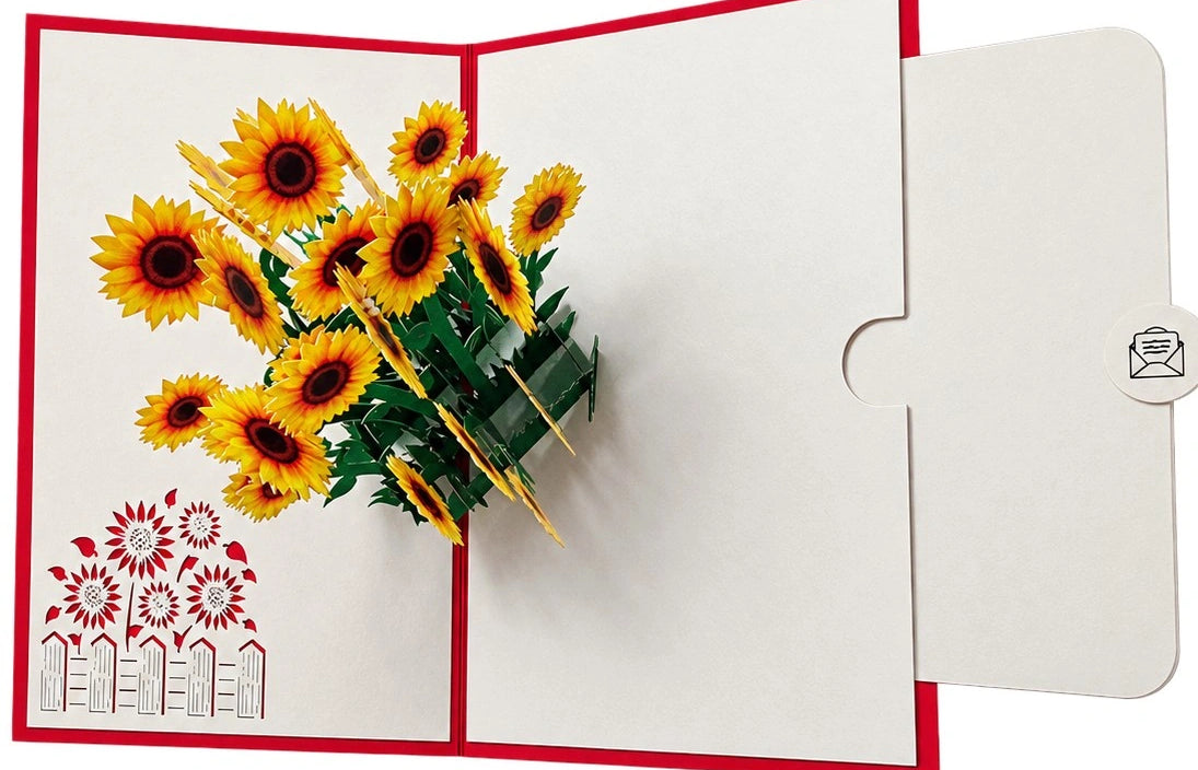 Aufgeklappte Pop-up-Karte mit rotem Rand und einem Strauß gelber Sonnenblumen. Auf der rechten Seite ein Einschub zum Beschriften.
