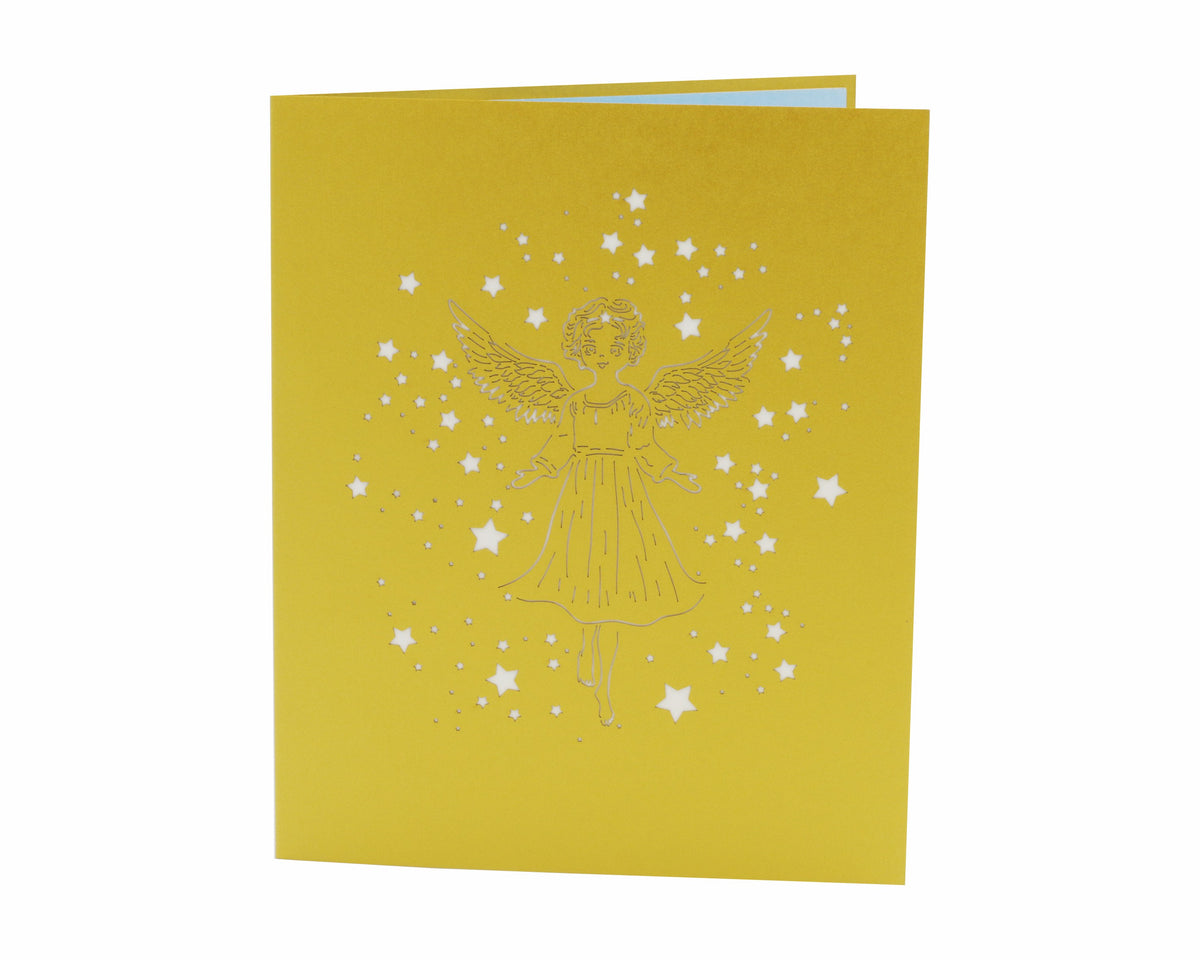 Goldene Klappkarte mit einem Scherenschnitt mit einem Engel und Sternen.