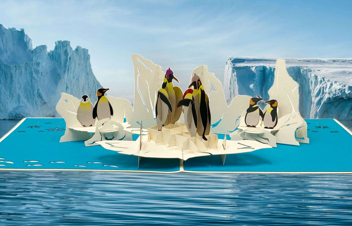 pop-up-karte-mit-pinguinen-auf-eisschollen-im-meer