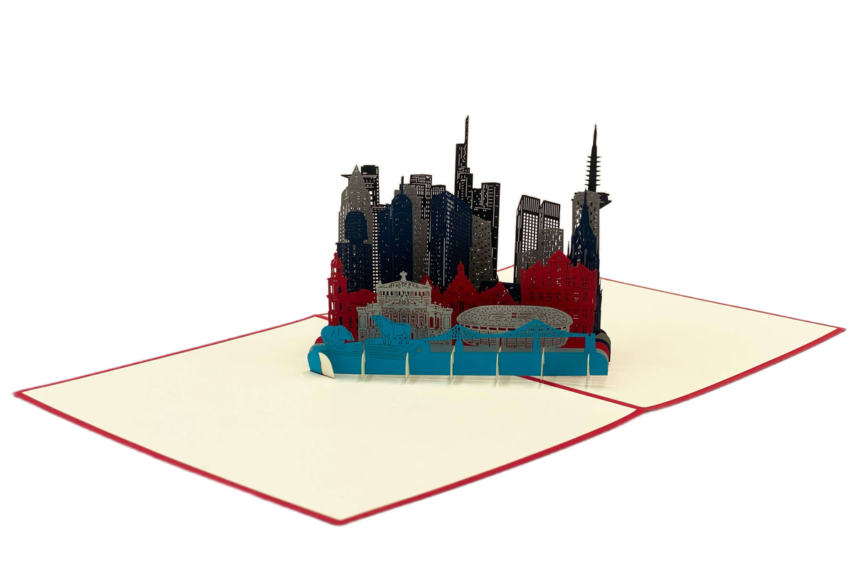 Aufgeklappte Pop-up-Karte mit der Frankfurter Skyline, schräg von der Seite fotografiert.