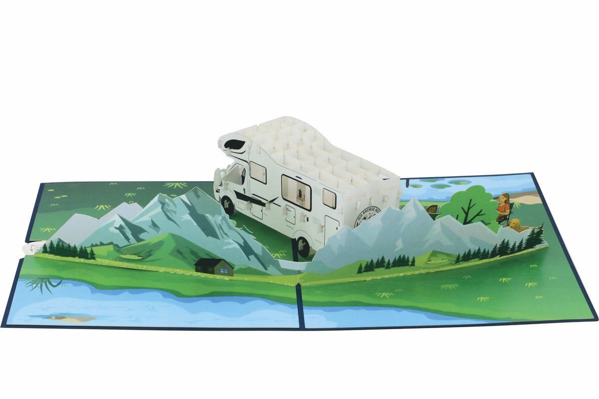 pop up karte mit einem weißen wohnmobil in der landschaft und bergen.