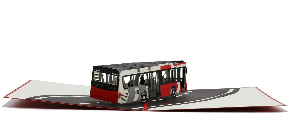 Aufgeklappte Pop-up-Karte mit einem Bus, flach von vorne fotografiert.