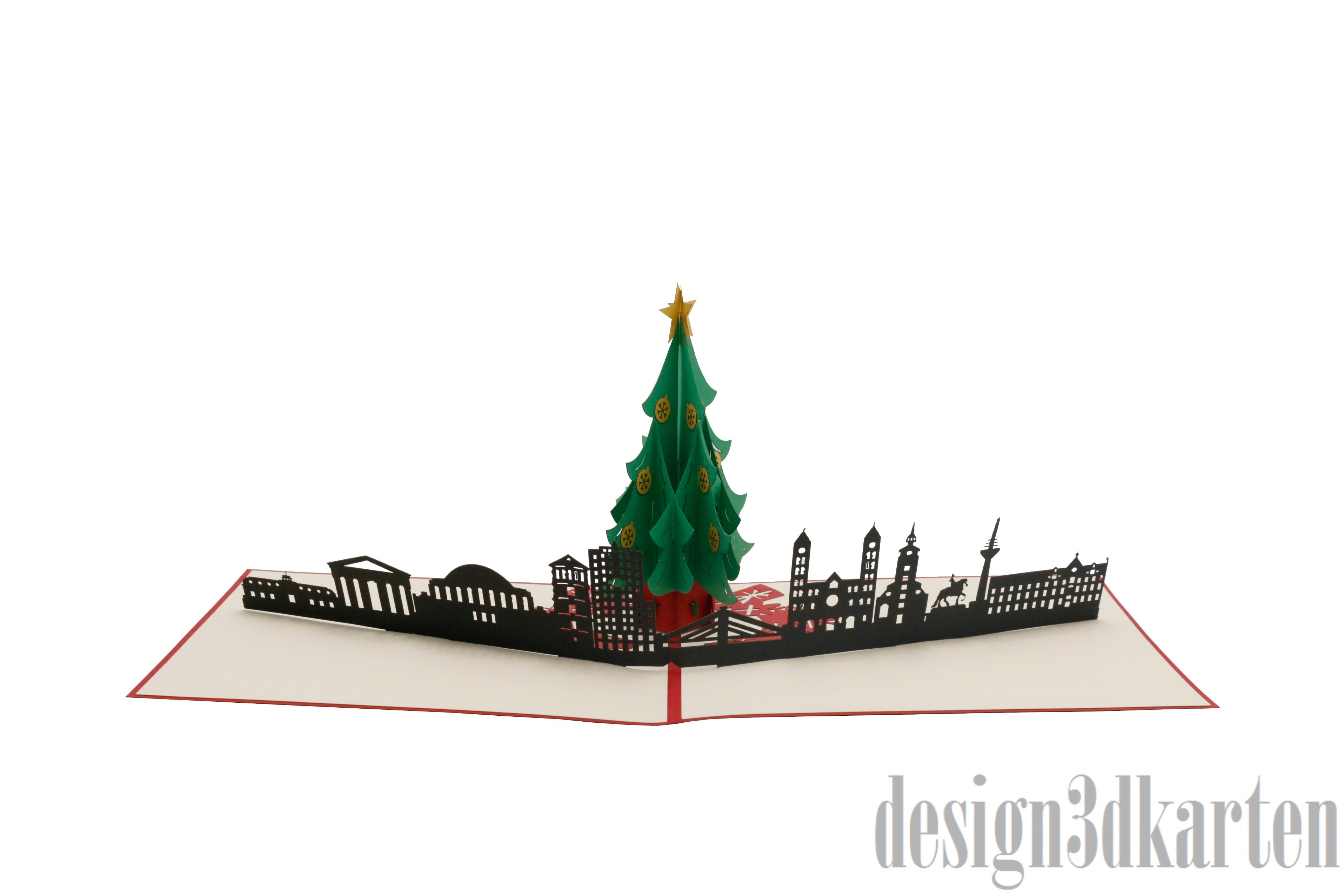 Aufgeklappte Pop-up-Karte mit Weihnachtsbaum vor der Düsseldorfer Skyline, seitlich fotografiert.