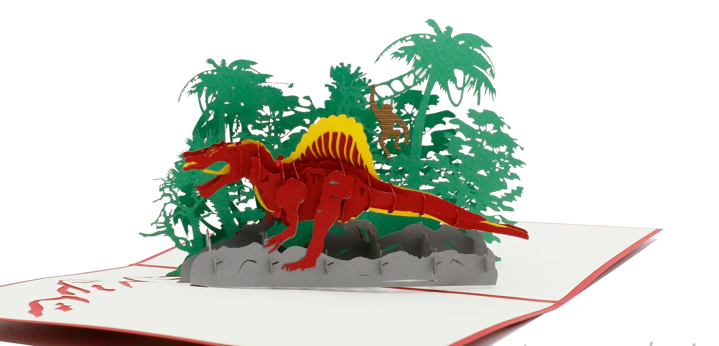 Nahaufnahme der aufgeklappten Pop-up-Karte mit rotem Dinosaurier zwischen Palmen und Farnen.