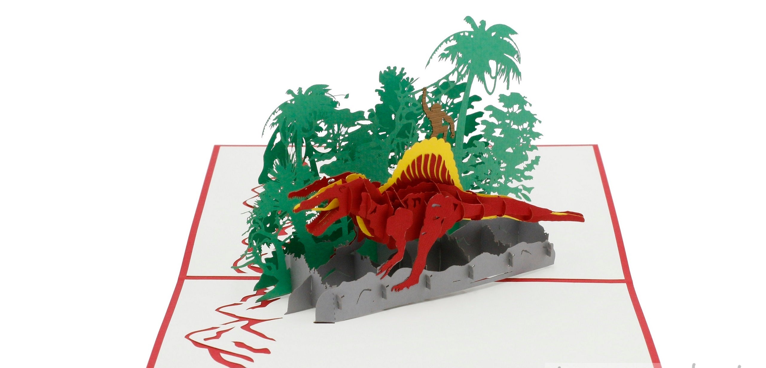 Aufgeklappte Pop-up-Karte mit rotem Rand: ein roter Dinosaurier mit gelbem Rückenkamm in einer grünen Dschungellandschaft.