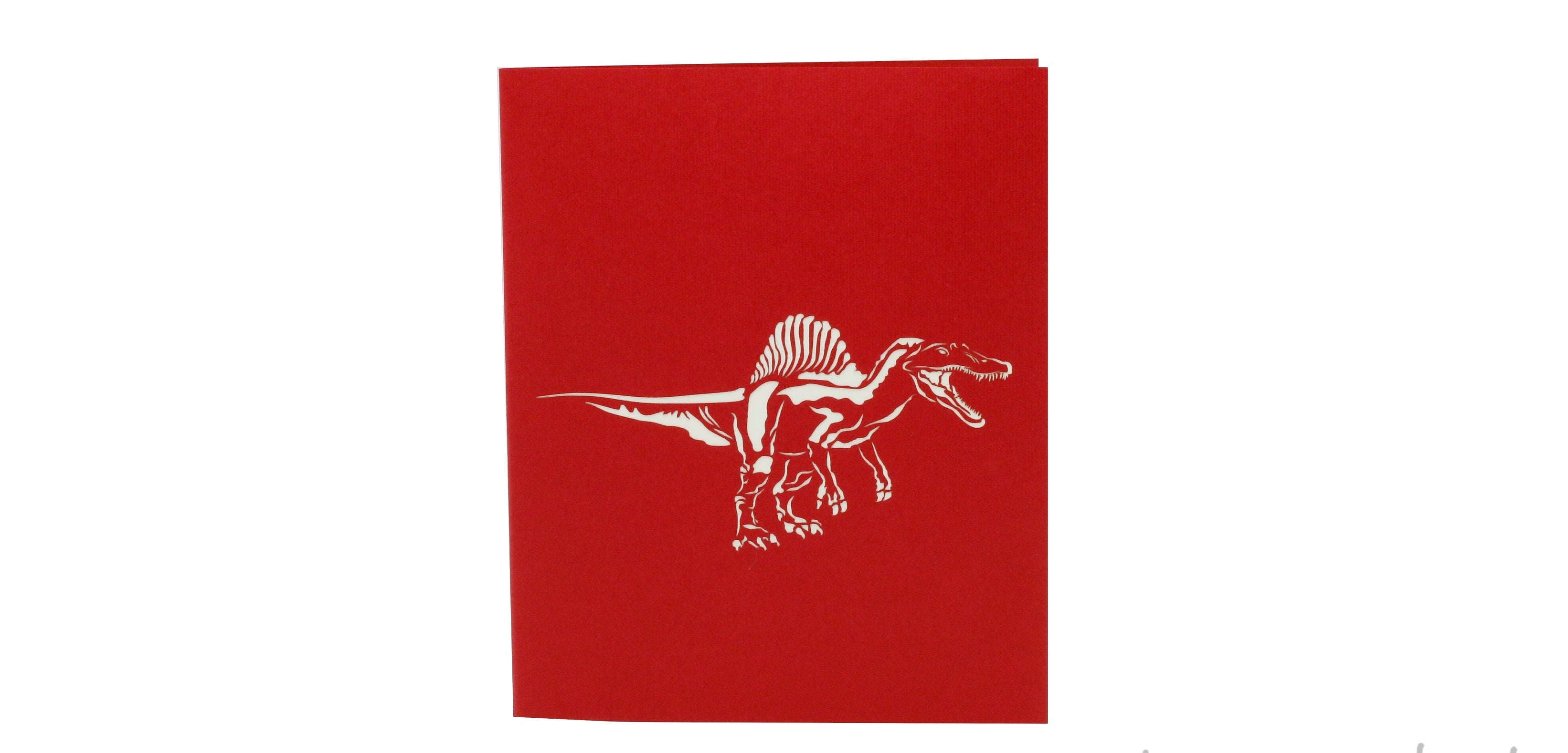 Rote Kartenvorderseite mit einem Dinosaurier als Scherenschnitt.