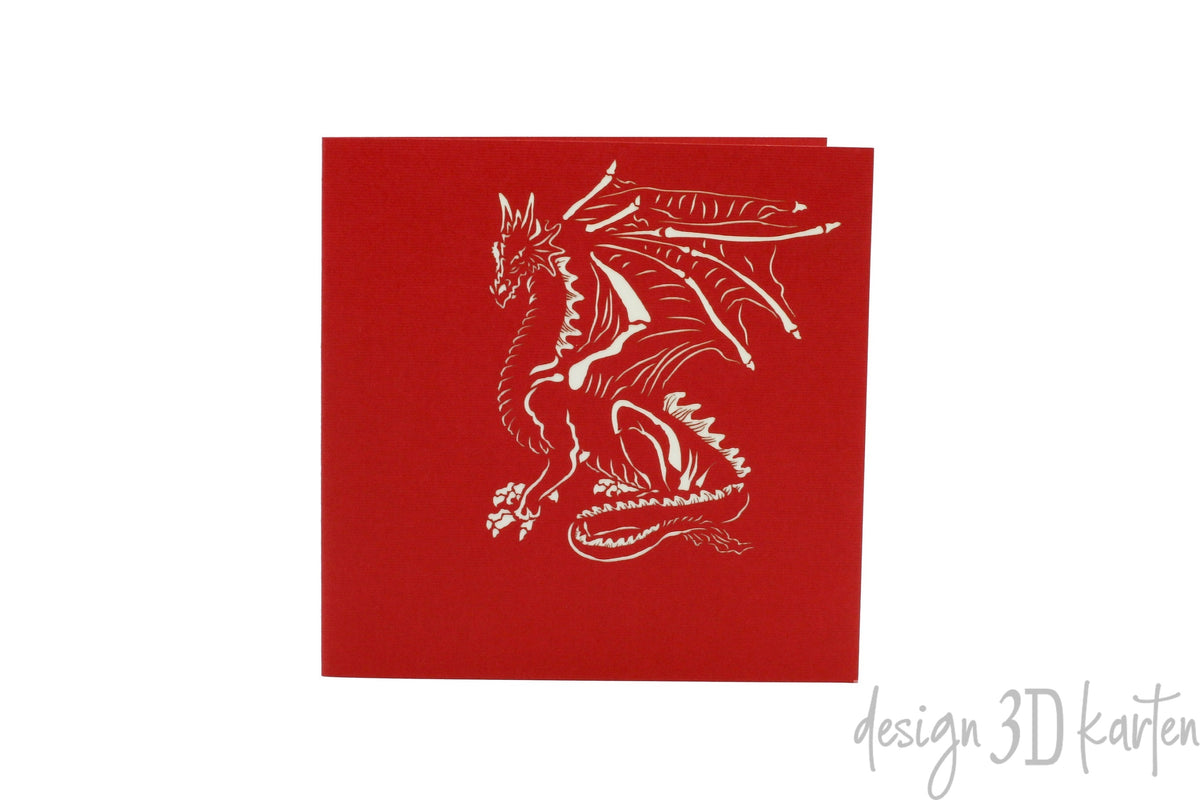 Rote Kartenvorderseite mit einem Drachen als Scherenschnitt.
