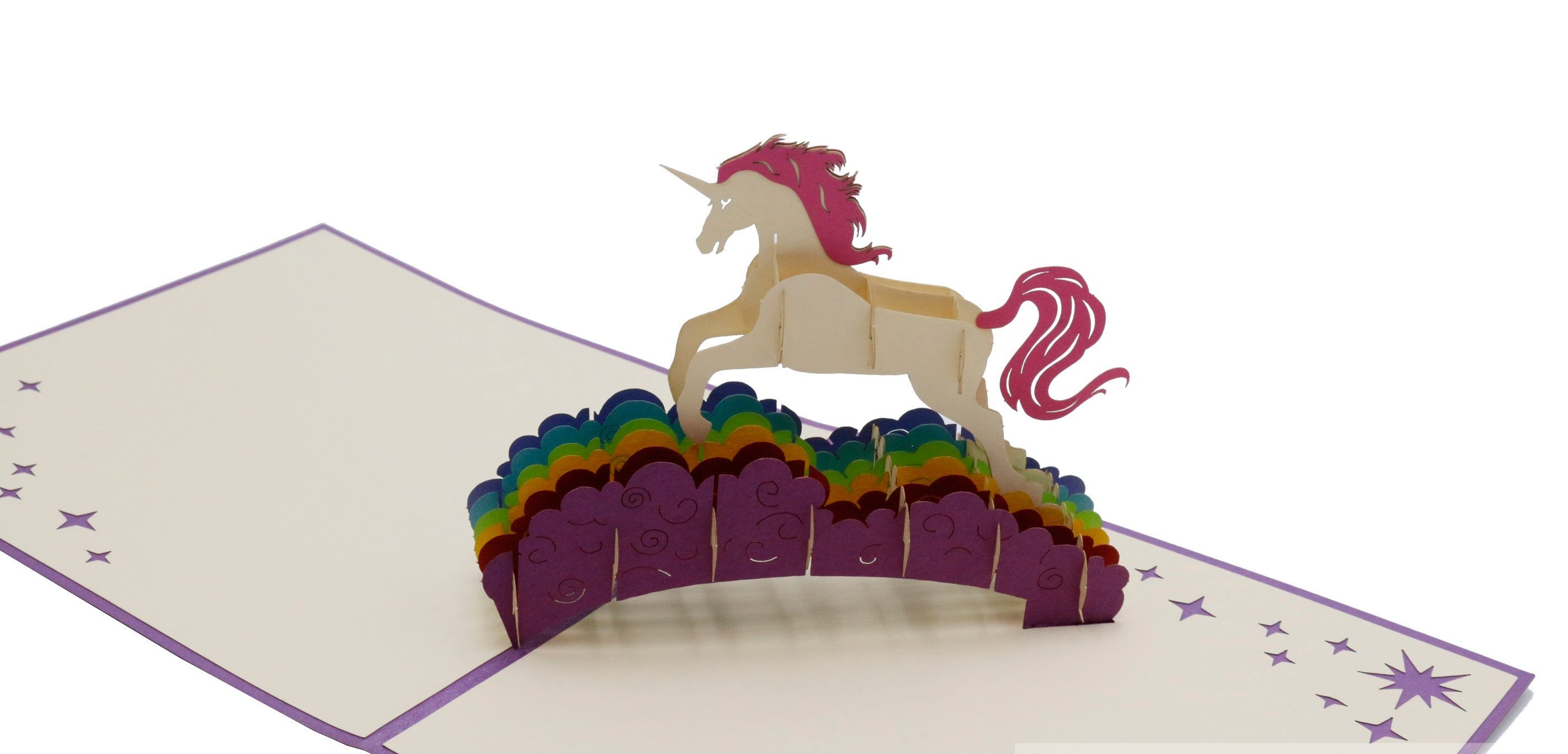 Aufgeklappte Pop-up-Karte mit lila Rand: ein weißes Einhorn mit pinker Mähne auf einer Regenbogenbrücke.