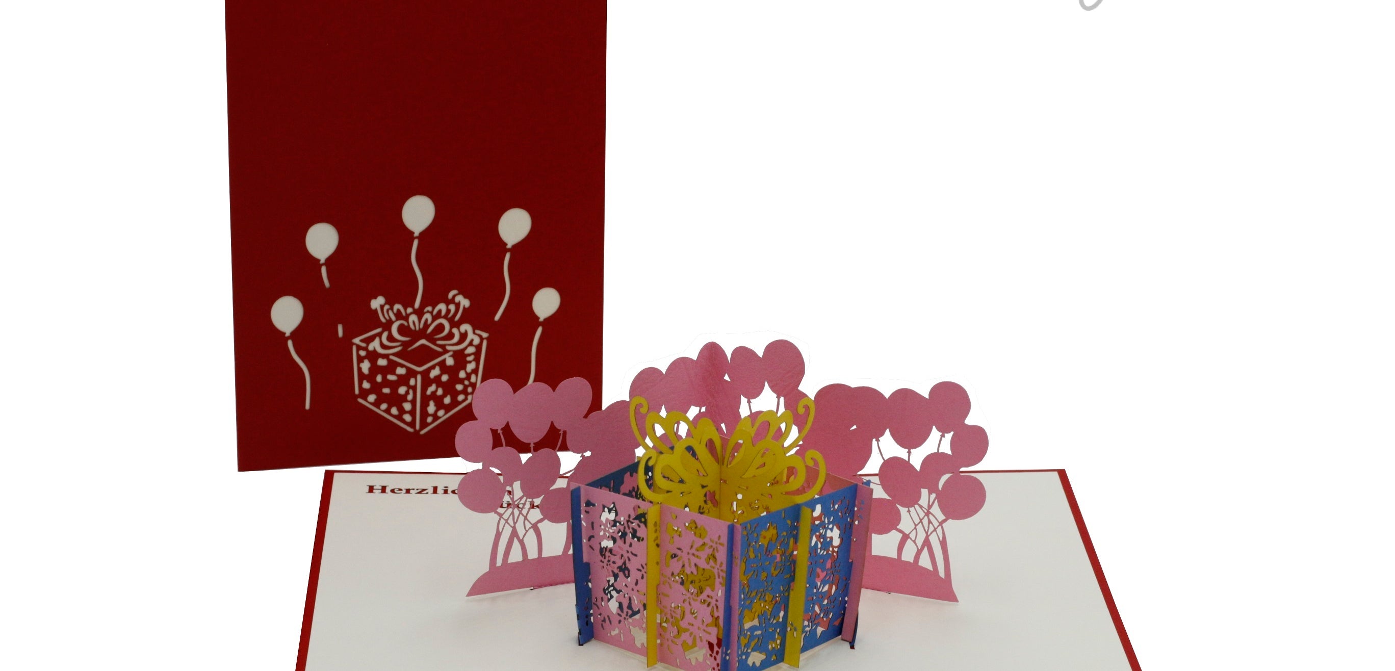 Aufgeklappte Pop-up-Karte mit bunter Geschenkbox und Luftballons, daneben die rote Kartenvorderseite.