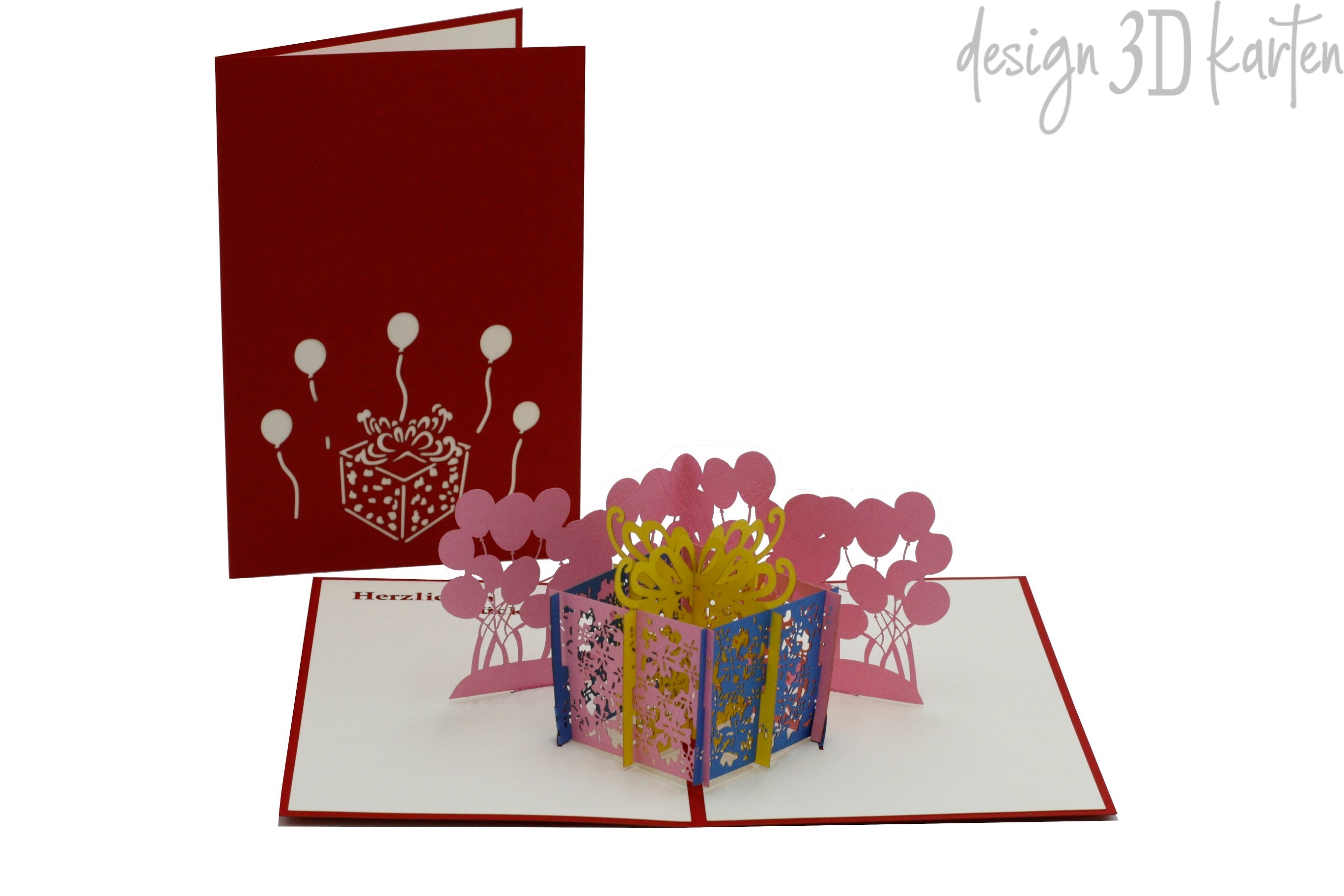 Aufgeklappte Pop-up-Karte mit bunter Geschenkbox und Luftballons, daneben die rote Kartenvorderseite.