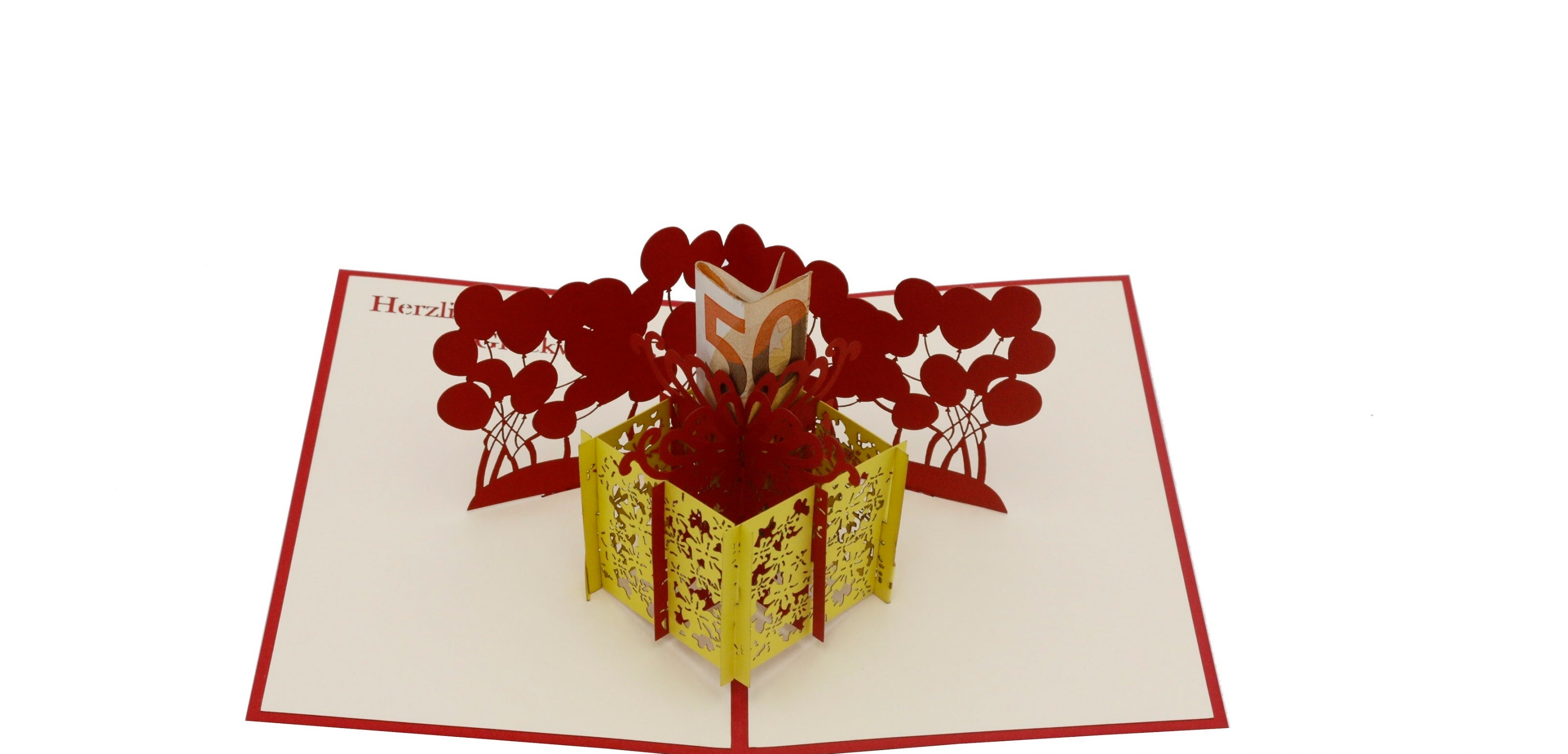 Aufgeklappte Pop-up-Karte mit rotem Rand: eine gelbe Geschenkbox, aus der rote Luftballons und ein Geldschein aufsteigen.