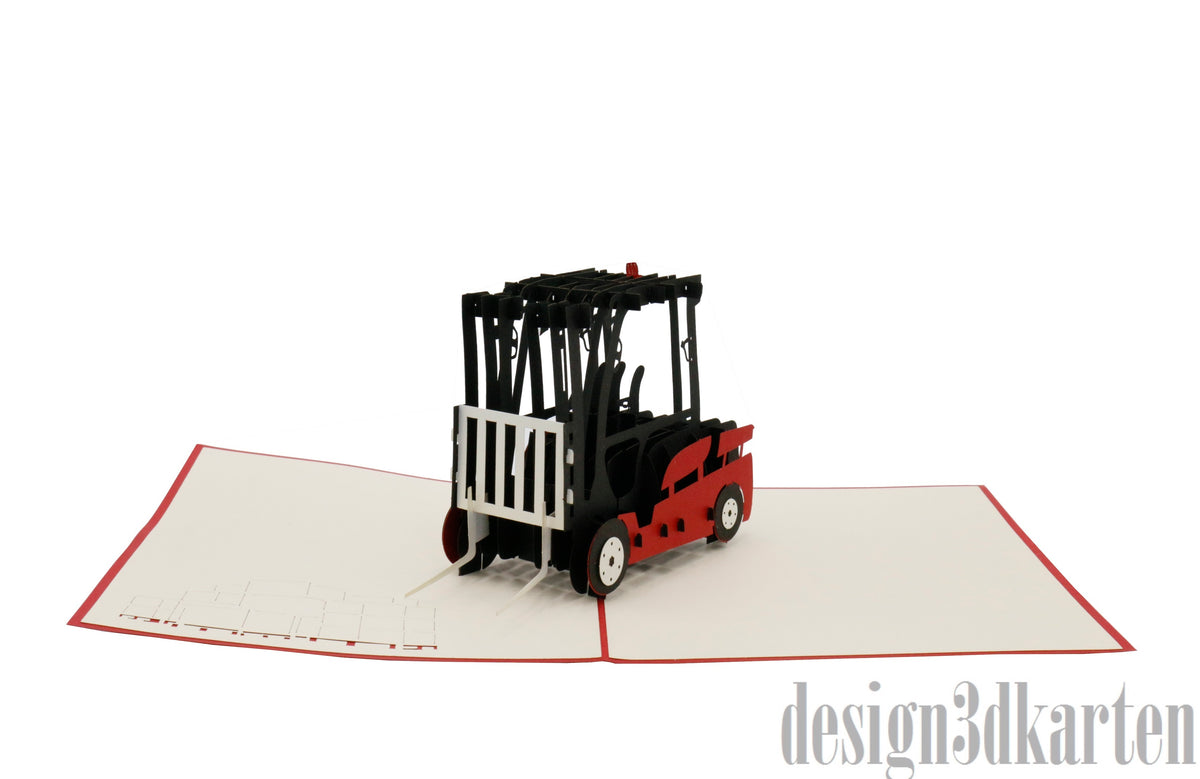 Aufgeklappte Pop-up-Karte mit rotem Gabelstapler, schräg von der Seite fotografiert.