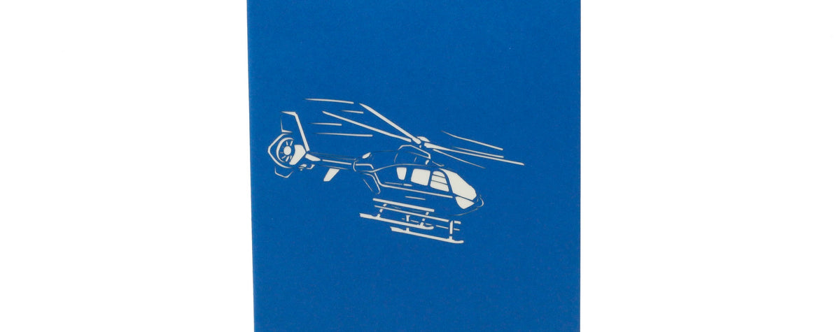 Blaue Kartenvorderseite mit einem Hubschrauber als Scherenschnitt.