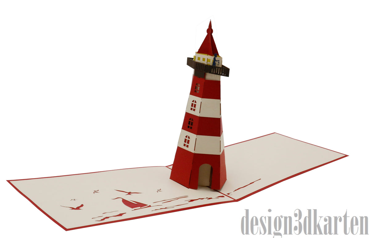 Aufgeklappte Pop-up-Karte mit einem rot-weiß gestreiften Leuchtturm aus Papier.