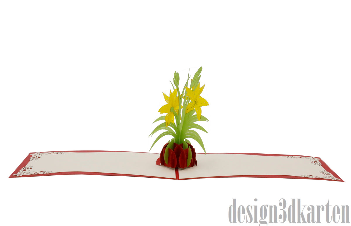 Aufgeklappte Pop-up-Karte mit gelben Lilien in einer Vase, flach von vorne fotografiert.