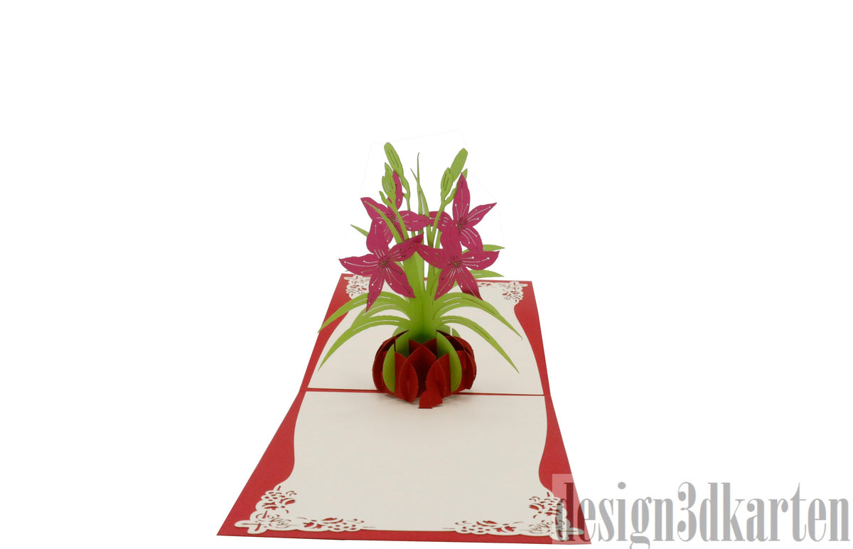 Aufgeklappte Pop-up-Karte mit rotem Rand und einem Strauß pinker Lilien in einer roten Vase.
