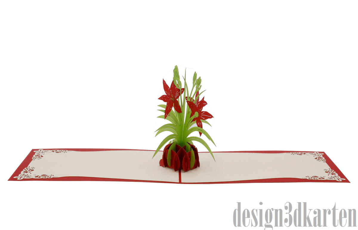 Aufgeklappte Pop-up-Karte mit roten Lilien in einer Vase, flach von vorne fotografiert.