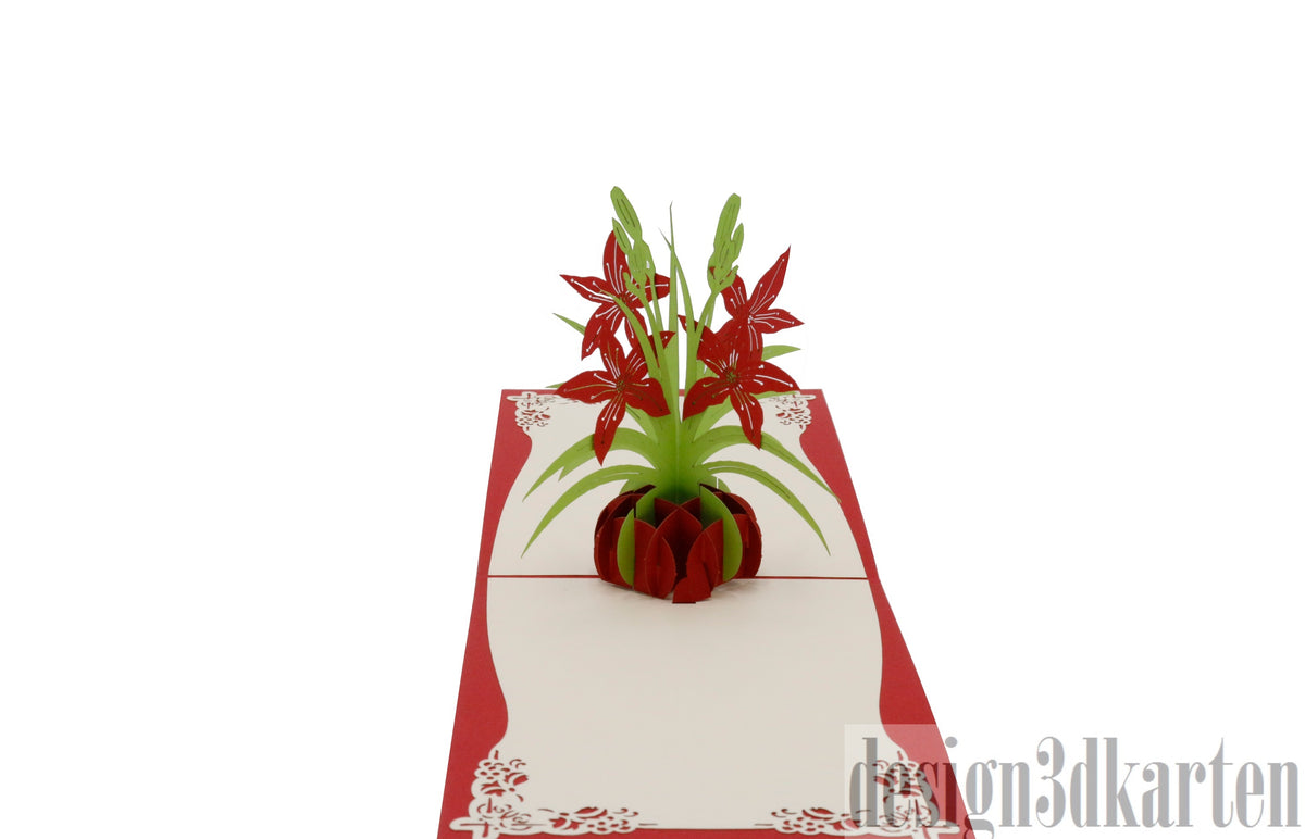 Aufgeklappte Pop-up-Karte mit rotem Rand und einem Strauß roter Lilien in einer roten Vase.