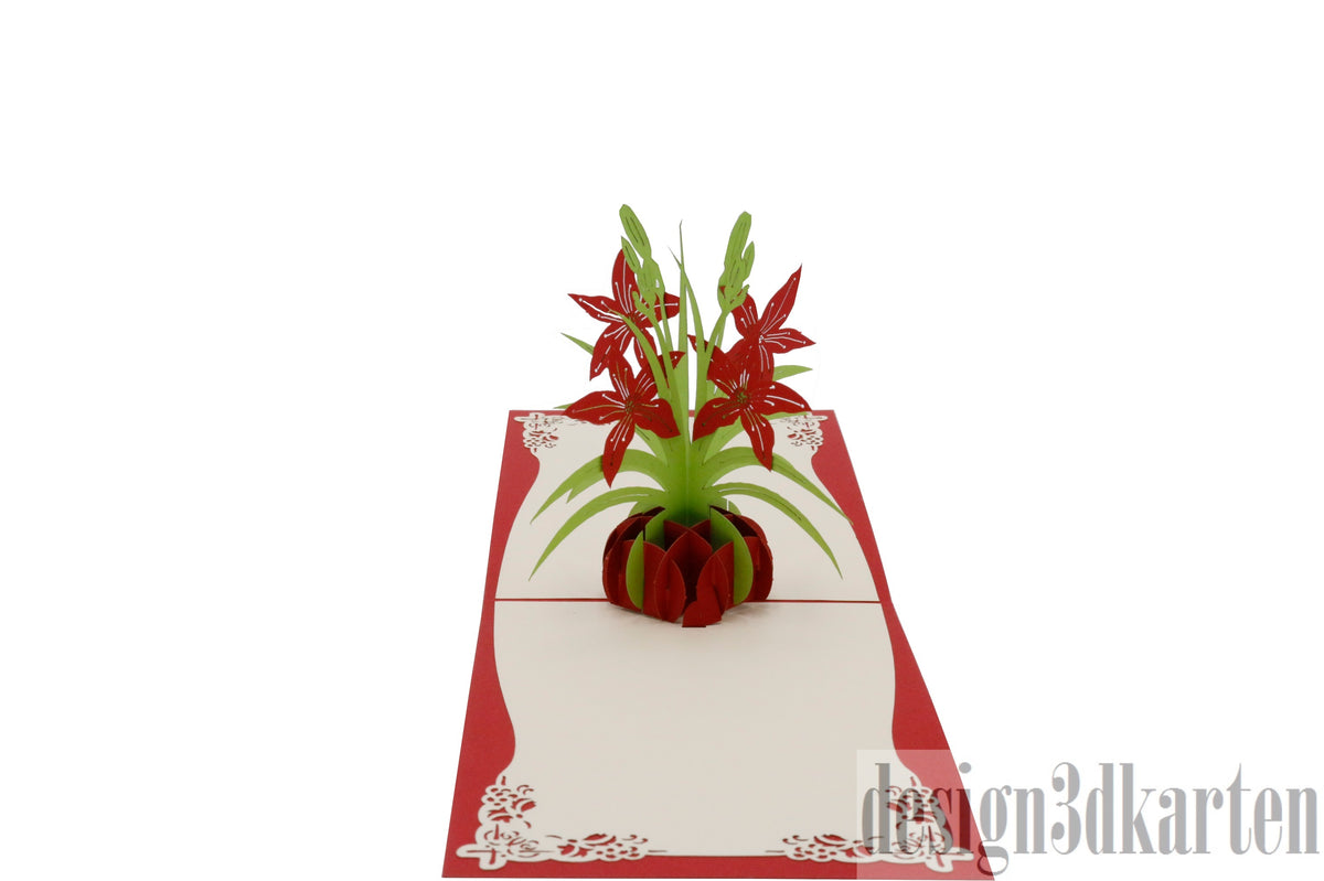 Aufgeklappte Pop-up-Karte mit rotem Rand und einem Strauß roter Lilien in einer roten Vase.