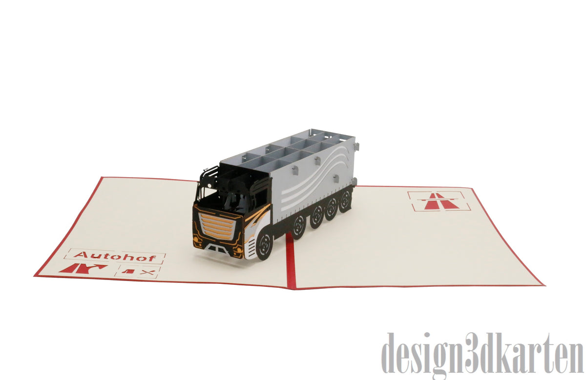 Aufgeklappte Pop-up-Karte mit rotem Rand und einem Sattelzug mit silbernem Auflieger, auf der Kartenfläche der Schriftzug Autohof.