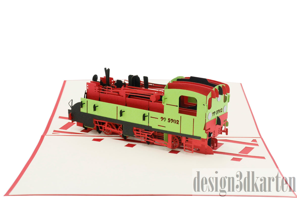 Aufgeklappte Pop-up-Karte mit detailreicher Dampflok in Rot und Grün auf angedeuteten Gleisen.