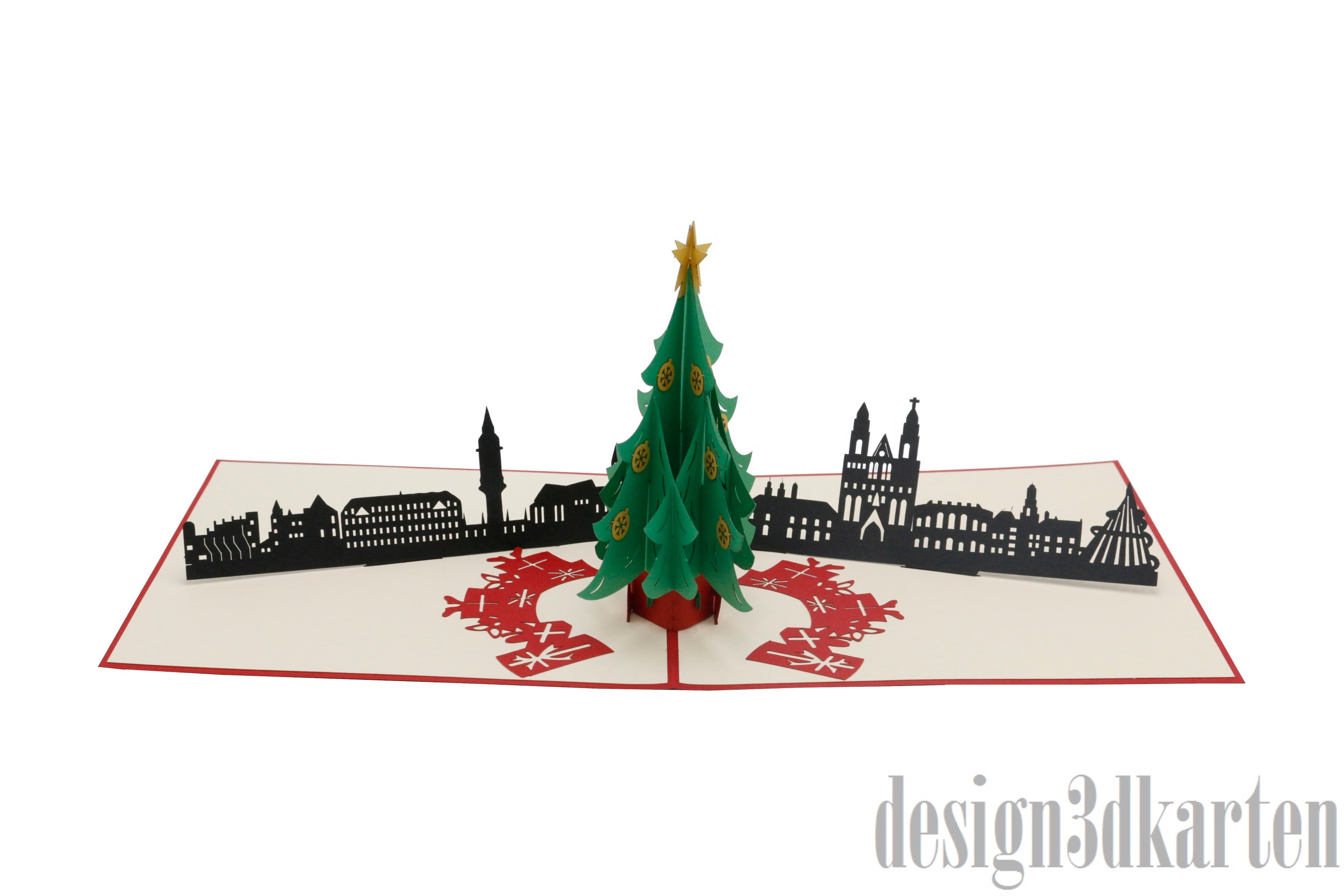Aufgeklappte Pop-up-Karte mit grünem Weihnachtsbaum vor der Skyline von Magdeburg.