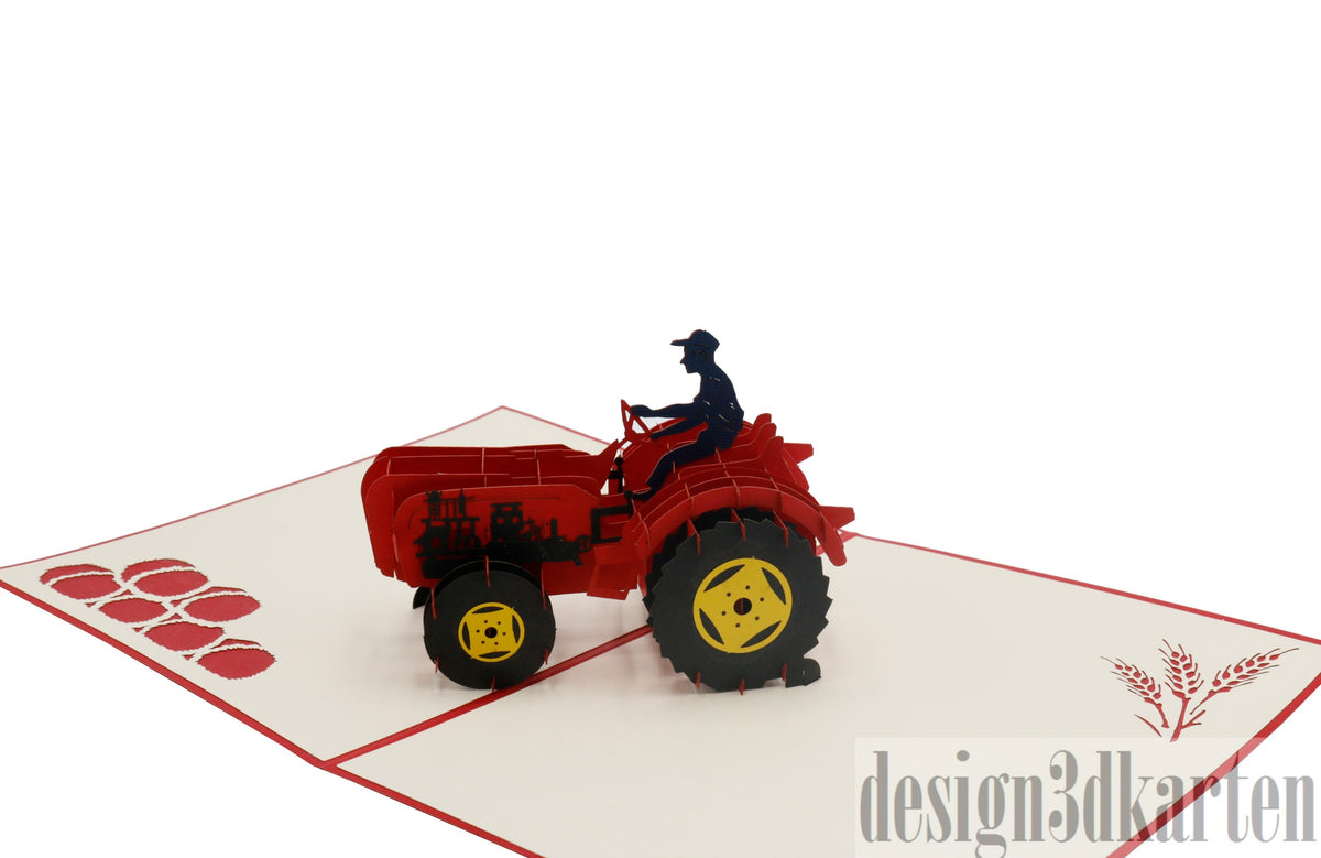 Nahaufnahme der aufgeklappten Pop-up-Karte mit rotem Oldtimer-Traktor und Fahrerfigur.