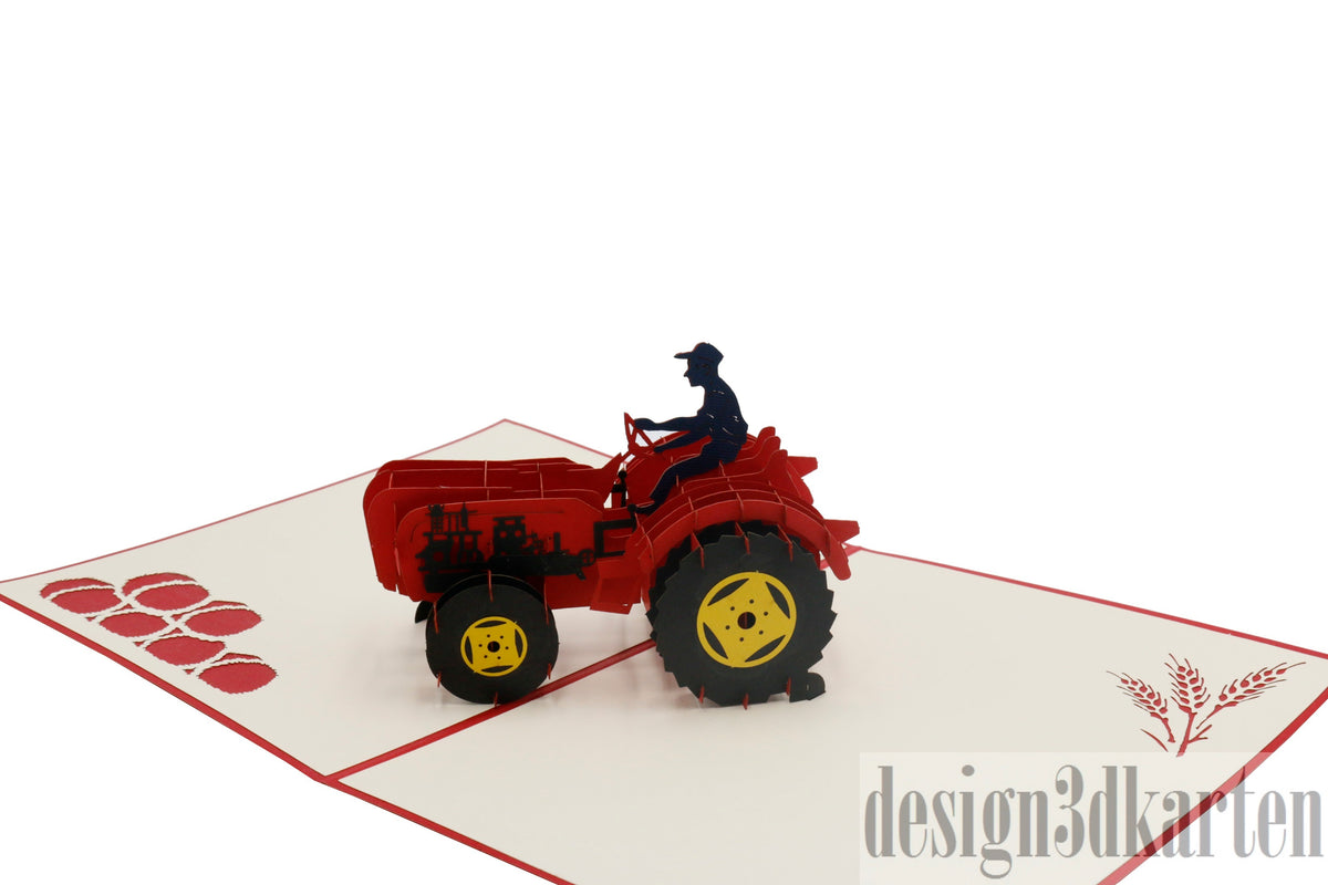 Nahaufnahme der aufgeklappten Pop-up-Karte mit rotem Oldtimer-Traktor und Fahrerfigur.