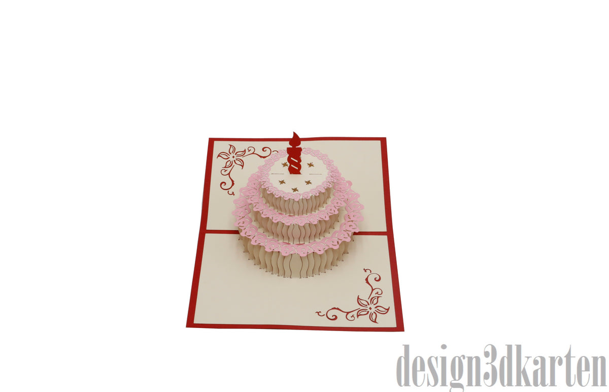 Aufgeklappte Pop-up-Karte mit einer Torte mit roter Kerze und rosa Spitzendekor.