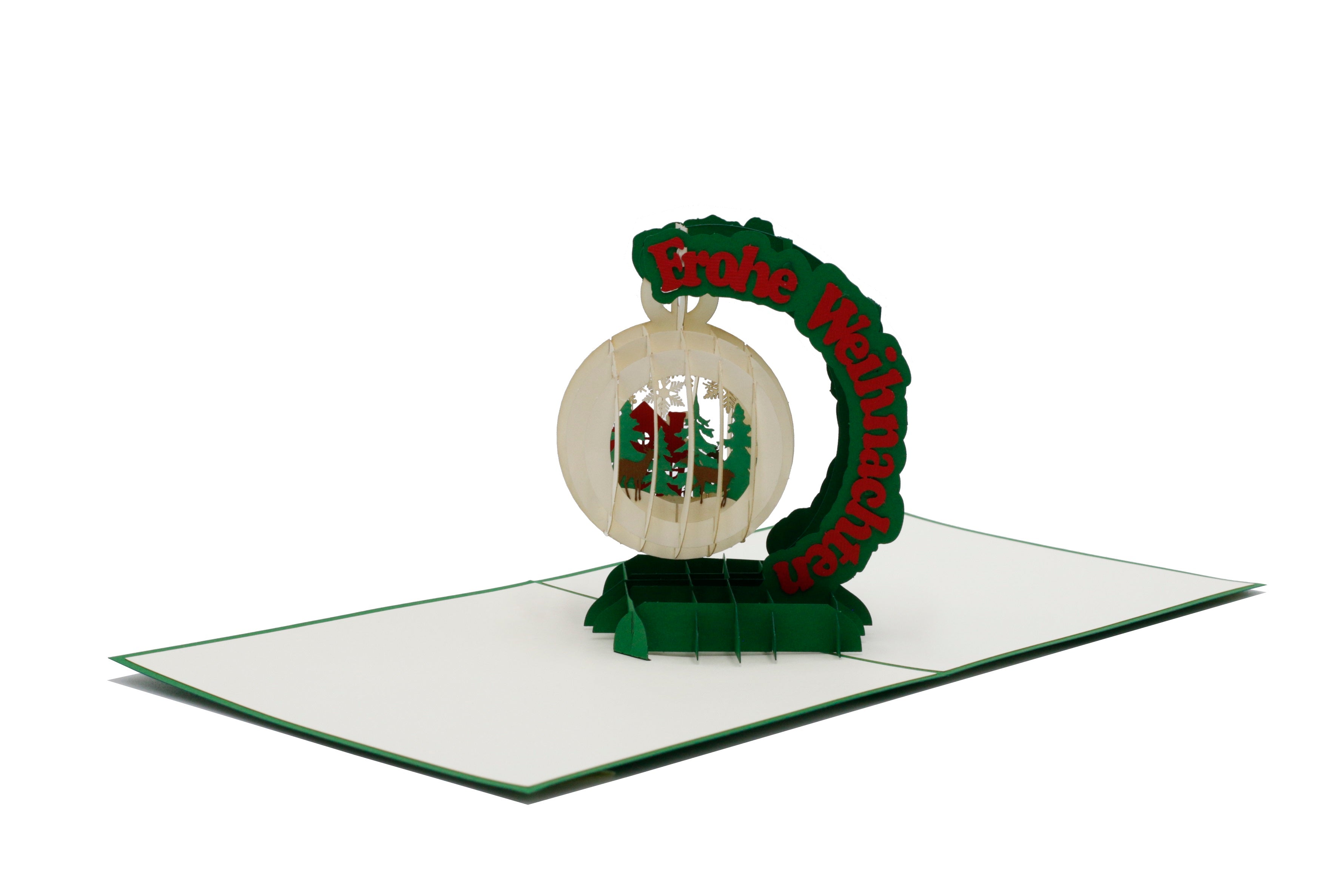 Aufgeklappte Pop-up-Karte mit Schneekugel aus Papier, schräg von der Seite fotografiert.