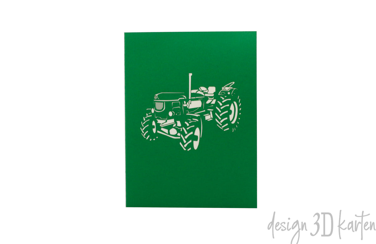 Grüne Kartenvorderseite mit einem Oldtimer-Traktor als Scherenschnitt.