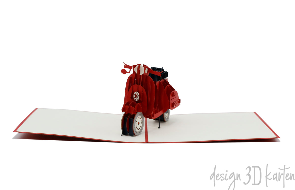 Aufgeklappte Pop-up-Karte mit roter Vespa, frontal von vorne fotografiert.