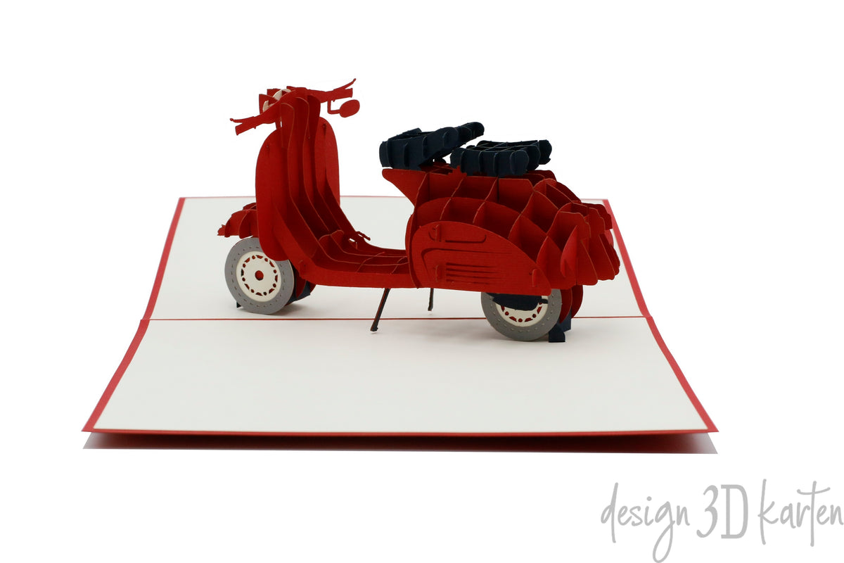 Nahaufnahme der aufgeklappten Pop-up-Karte mit einer roten Vespa auf rotem Rand.