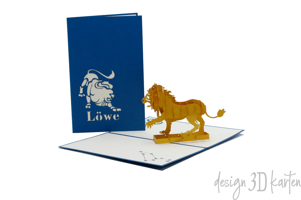 Aufgeklappte Pop-up-Karte mit goldenem Löwen, daneben die dunkelblaue Kartenvorderseite mit dem Schriftzug Löwe.