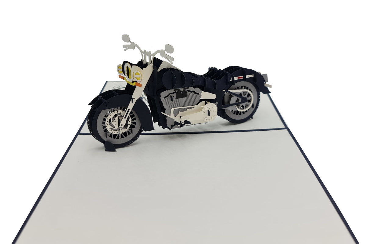 Aufgeklappte Pop-up-Karte mit einem schwarz-cremefarbenen Chopper-Motorrad aus Papier.